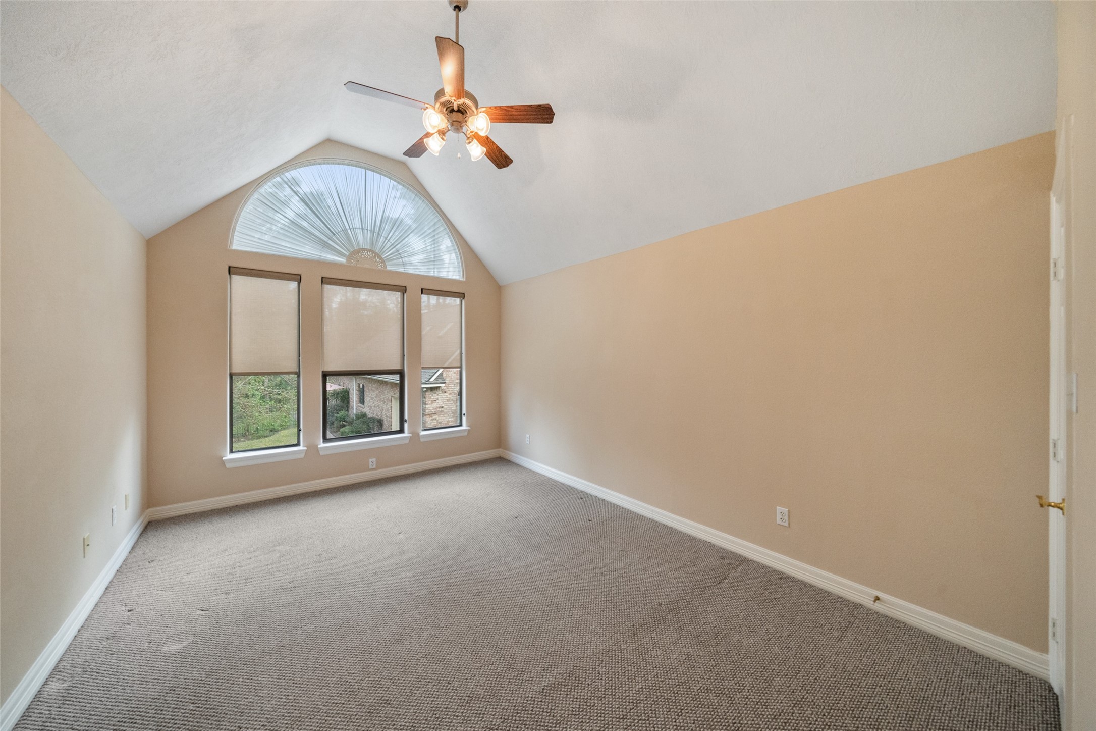 Upstairs spacious room features a vaulted ceiling with large windows with unique arch detail, allowing plenty of natural light. This room can be used for a 4th bedroom, a craft room, exercise room, 2nd office, the options or numerous.