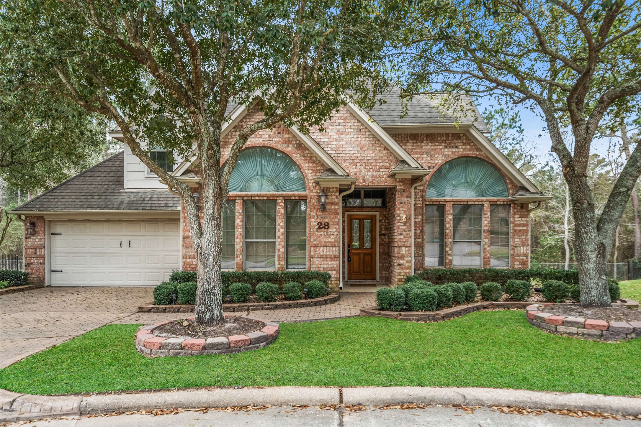 Welcome Home! Charming brick home with large arched windows, and a tidy front yard. Features a two-car garage and mature trees offering shade and privacy. Ideal for a cozy, suburban lifestyle. Welcome Home! Charming brick home with large arched windows, and a tidy front yard. Features a two-car garage and mature trees offering shade and privacy. Ideal for a cozy, suburban lifestyle.