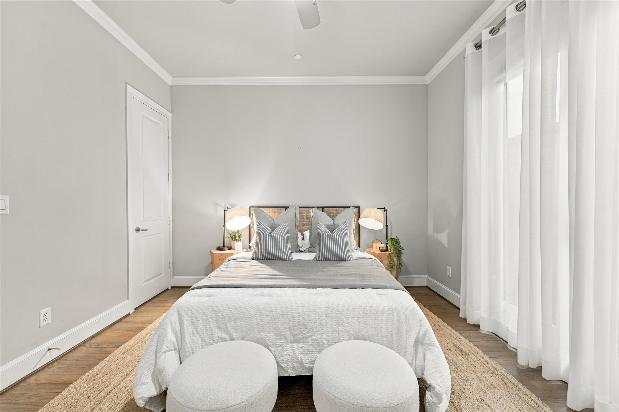 First-floor guest suite with a full wall of soft, filtered light