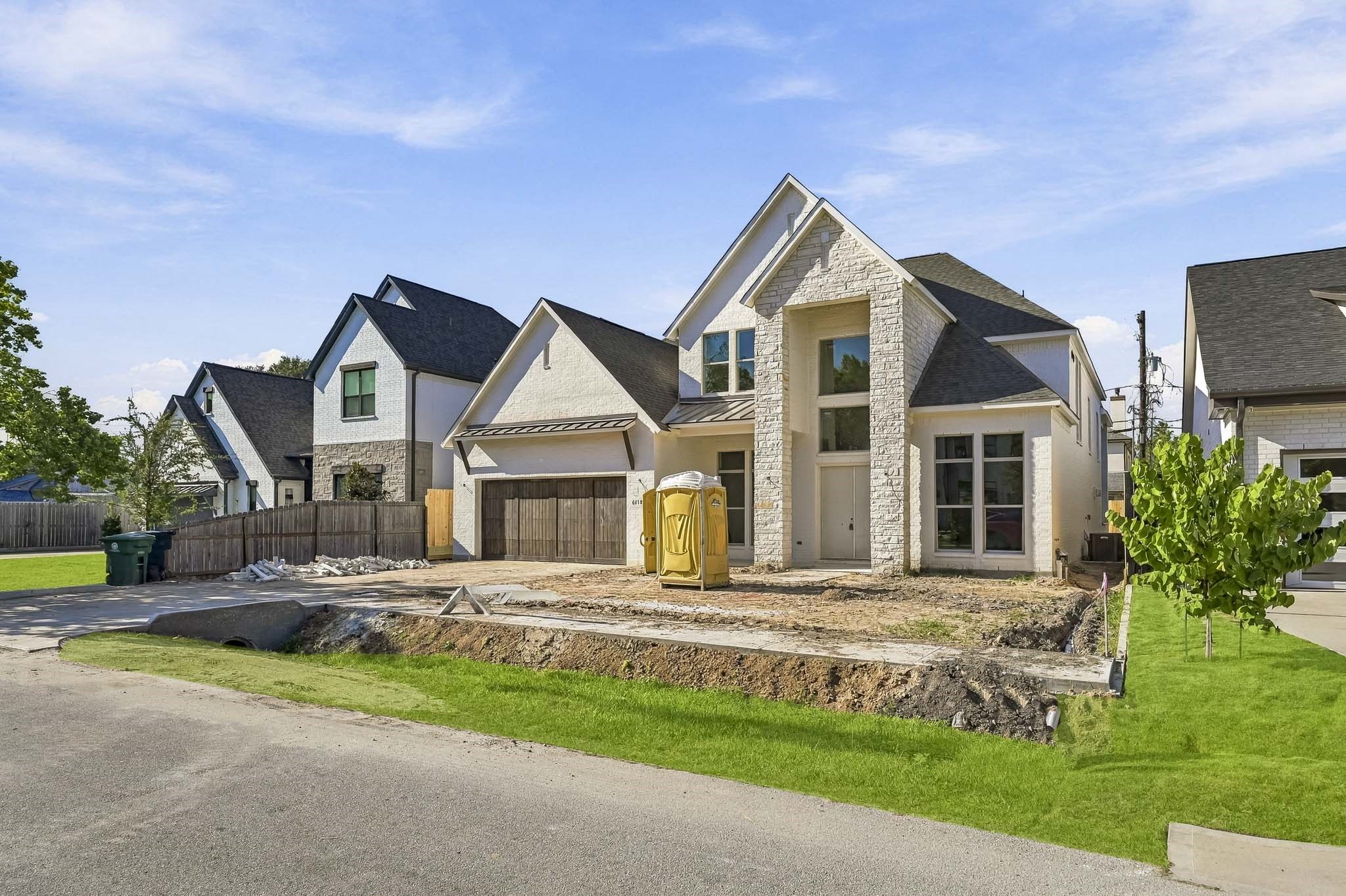 Striking stone facade, large windows, and a oversized two-car garage!