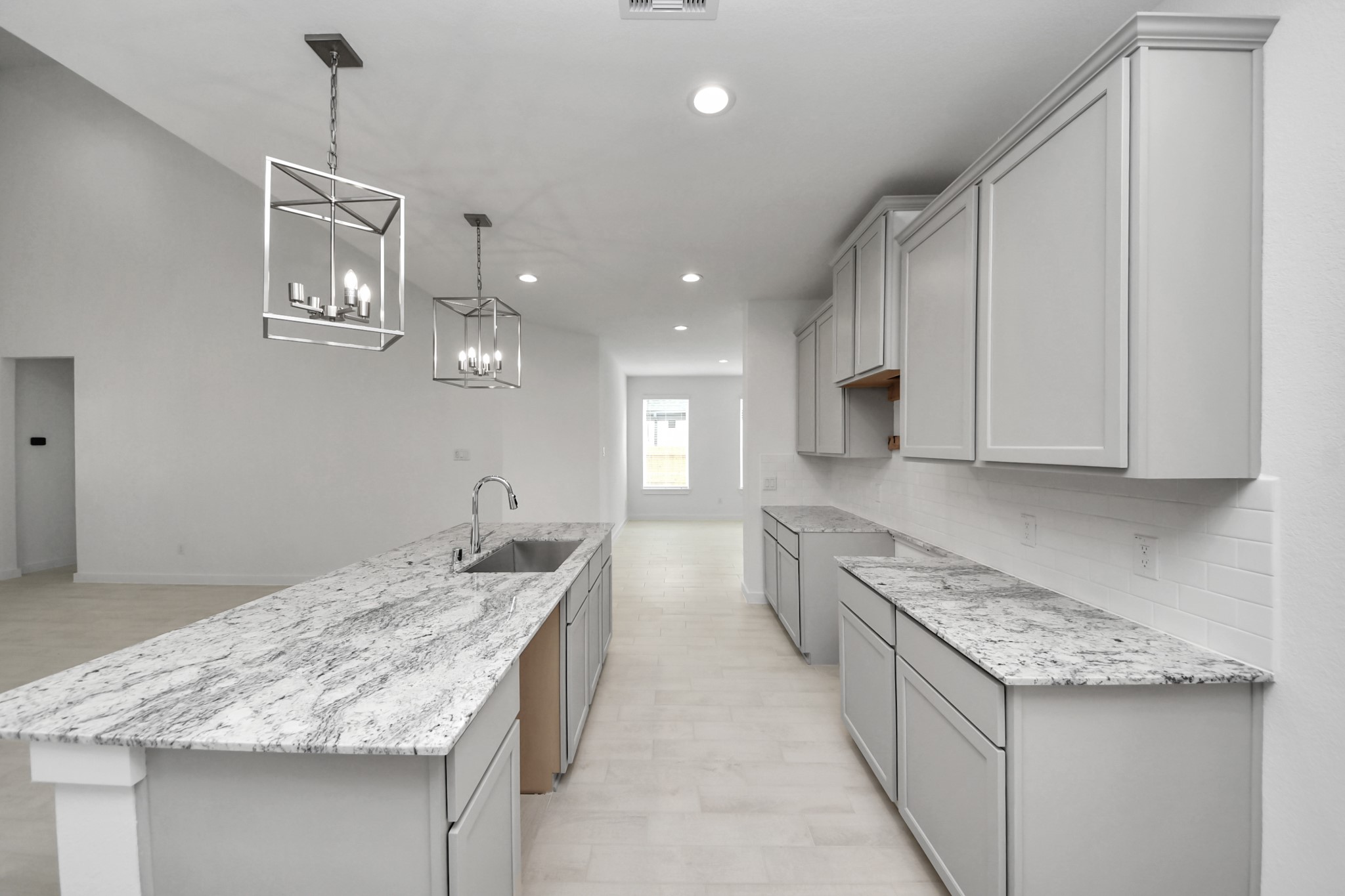 This generously spacious kitchen is a dream realized! Sample photo of completed home with similar floor plan. Actual colors and selections may vary.