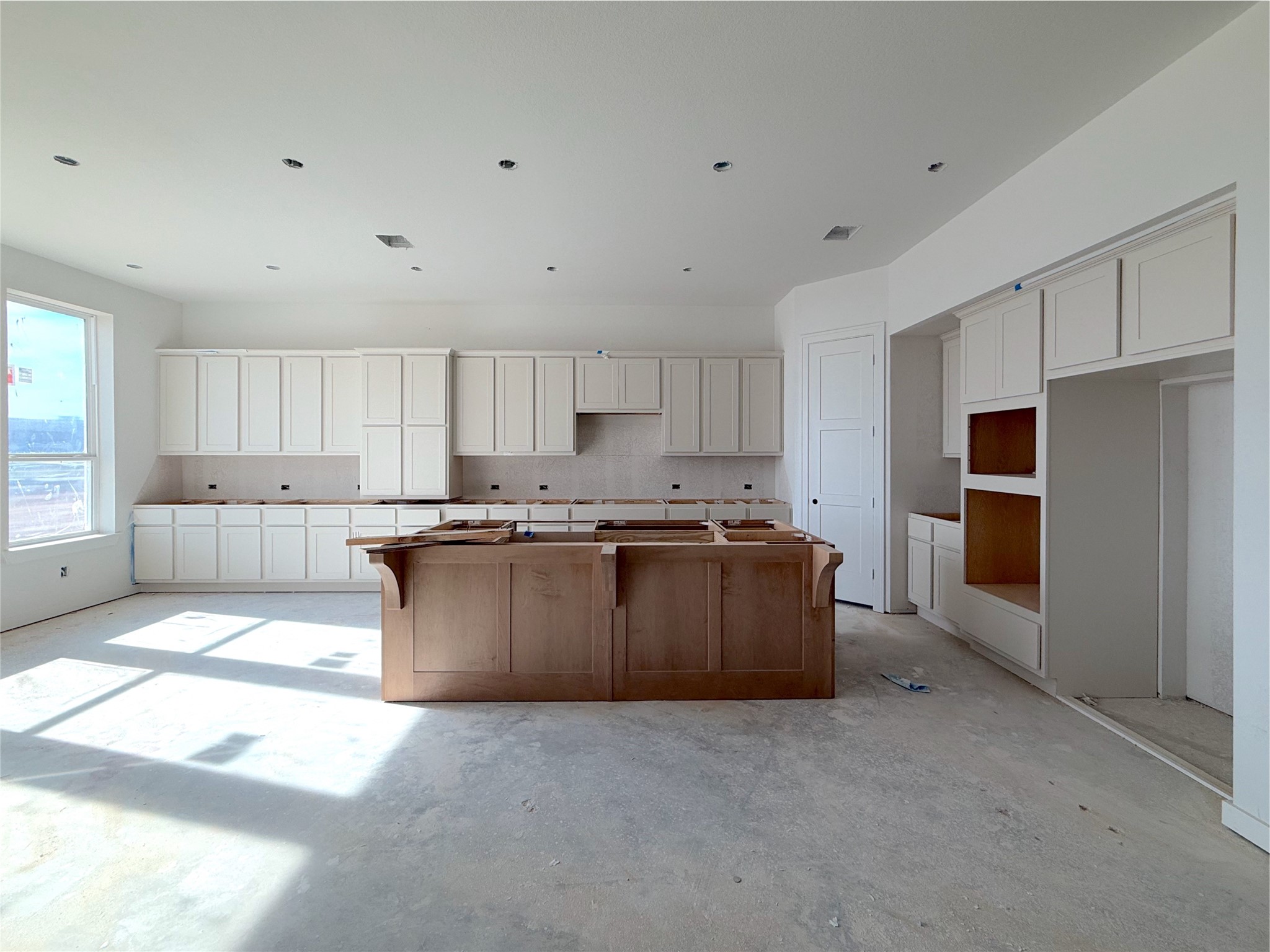 Upgraded kitchen with two tone cabinets, Large island with and cabinets extending to the wall. Upgraded kitchen with two tone cabinets, Large island with and cabinets extending to the wall.
