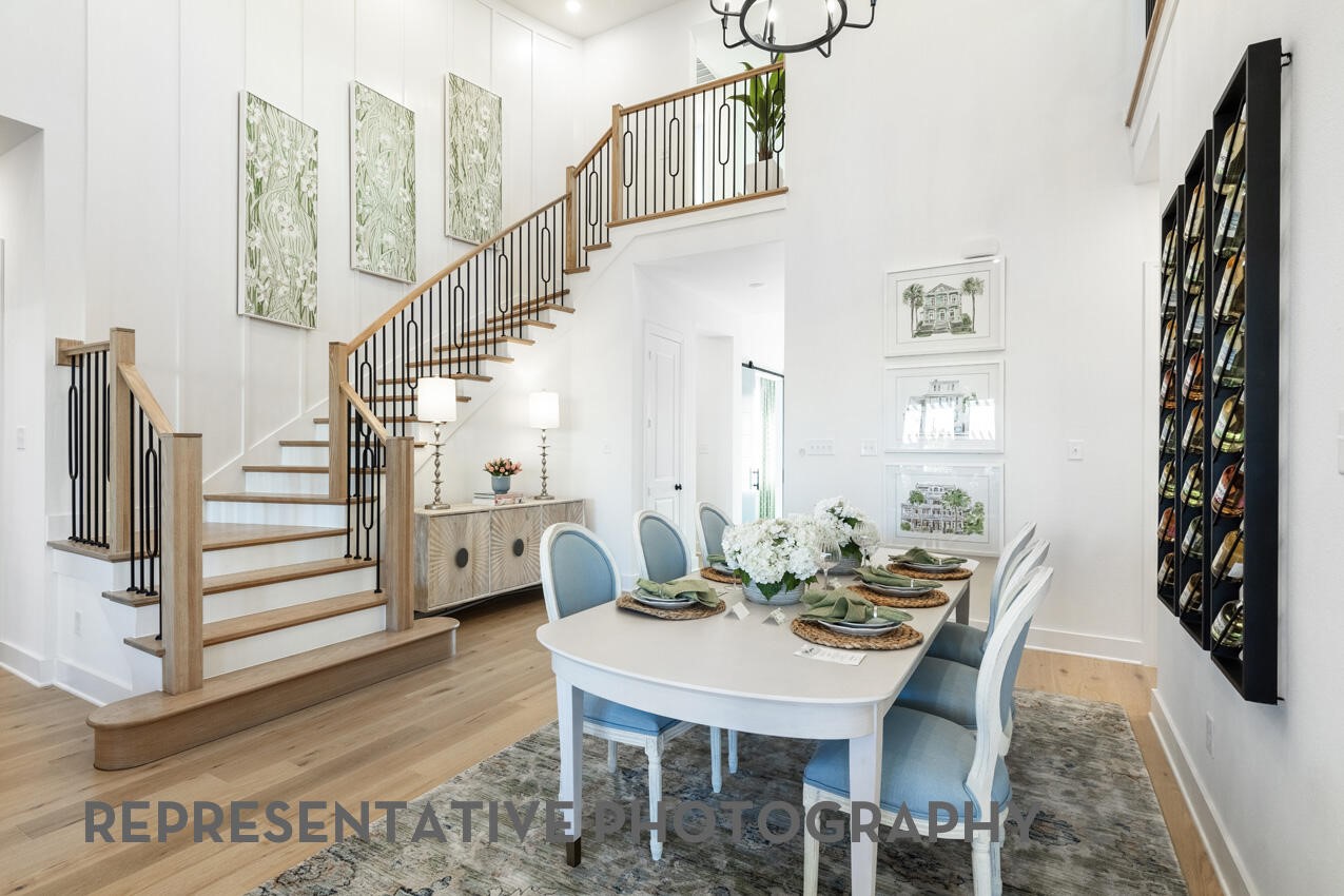 Elegant dining room overlooking the grand foyer and staircase, perfect for everyday meals or entertaining. Elegant dining room overlooking the grand foyer and staircase, perfect for everyday meals or entertaining.