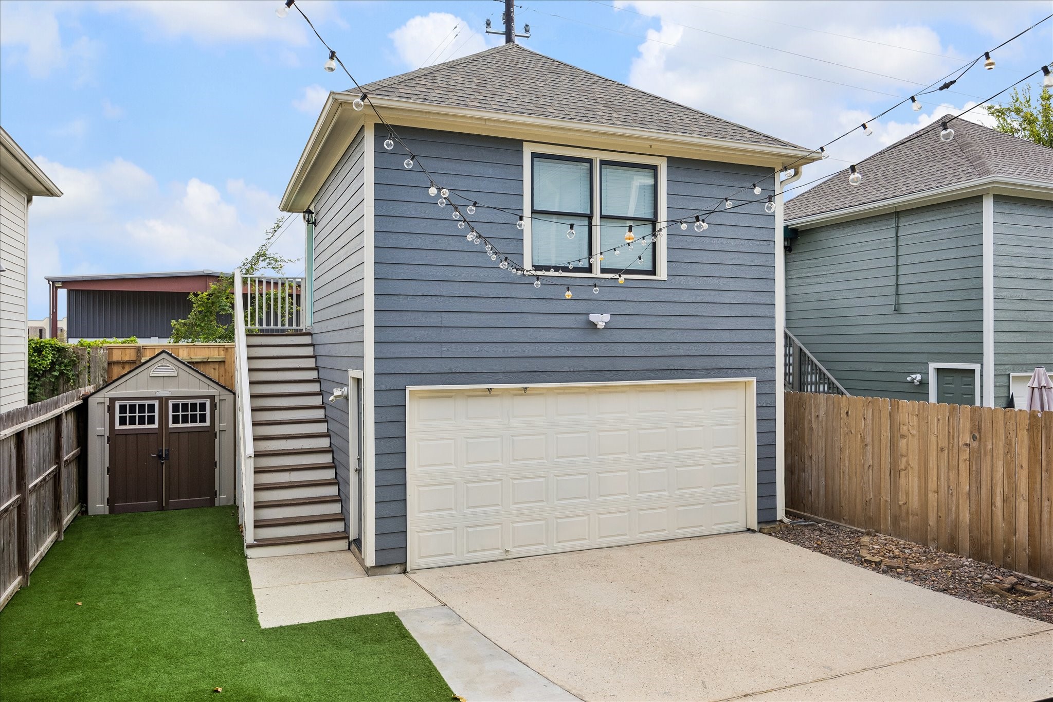 The finished garage apartment offers versatile additional space with its own exterior staircase and separate entrance.