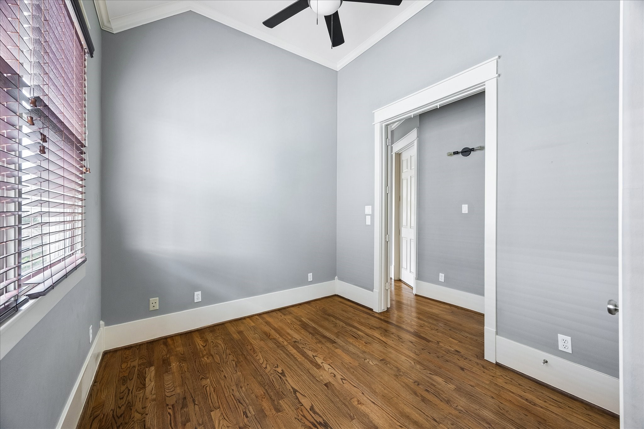 A third upstairs bedroom offers a comfortable, versatile space with access to the shared Jack-and-Jill bathroom.