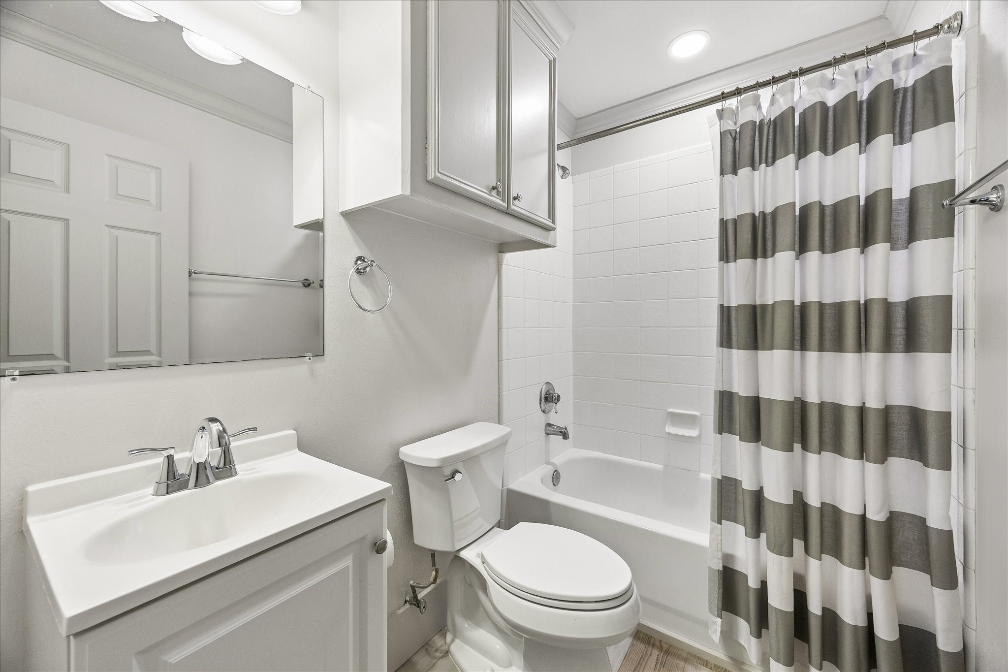 A private full bathroom with a tub-shower combination completes this versatile garage apartment.