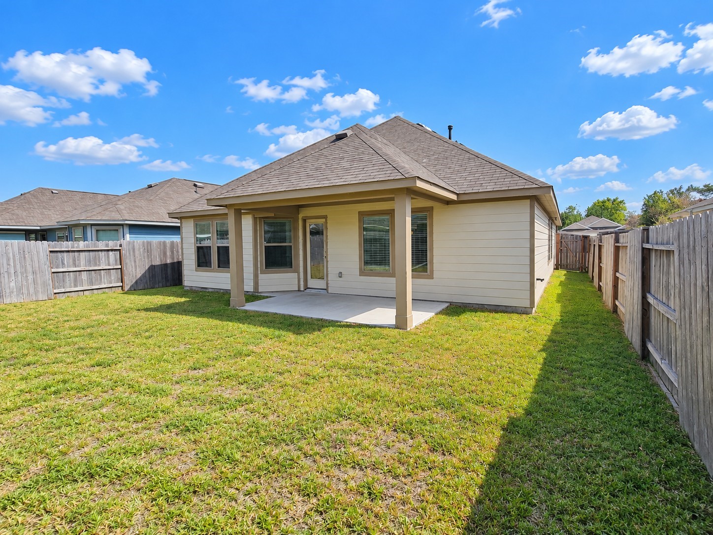 Spacious backyard with covered patio