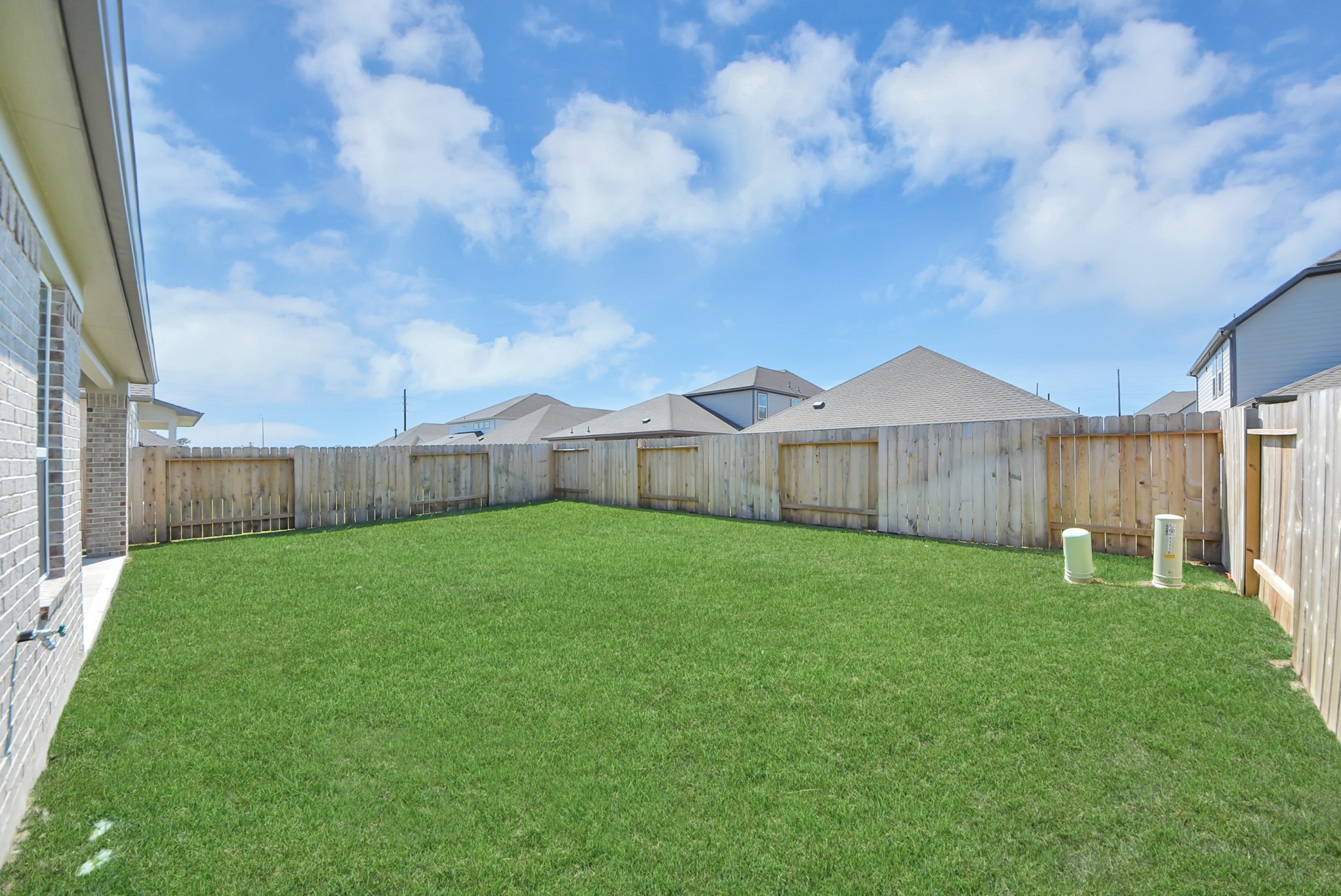 Backyard retreat, offering an abundance of space for kids to play and explore. The possibilities are endless in this outdoor haven, where the joy of open-air activities and family gatherings awaits.