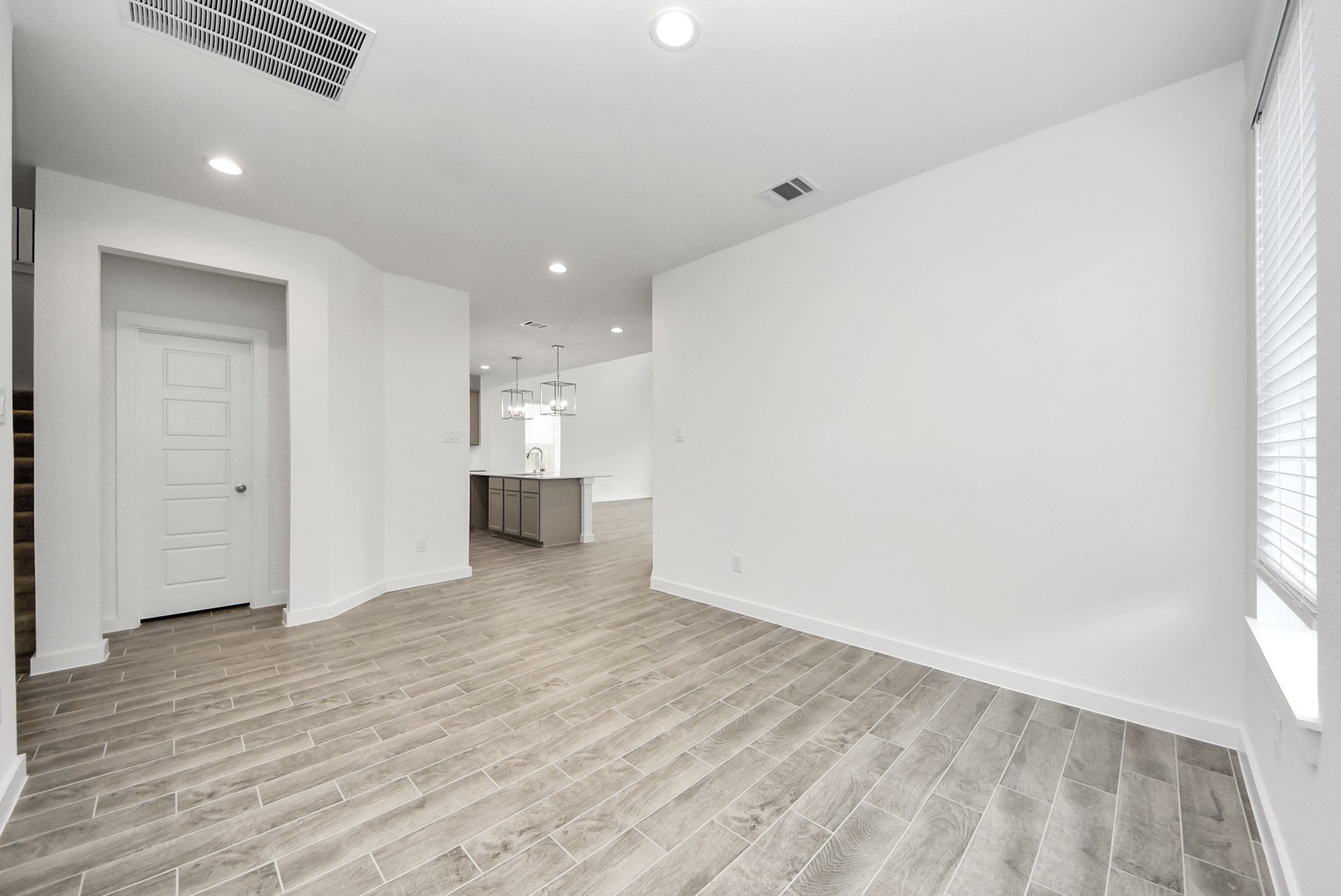 Make memories gathered around the table with your family and friends! This spacious dining room features elegant flooring, custom paint, and adjacent to family room and kitchen for open concept feel.