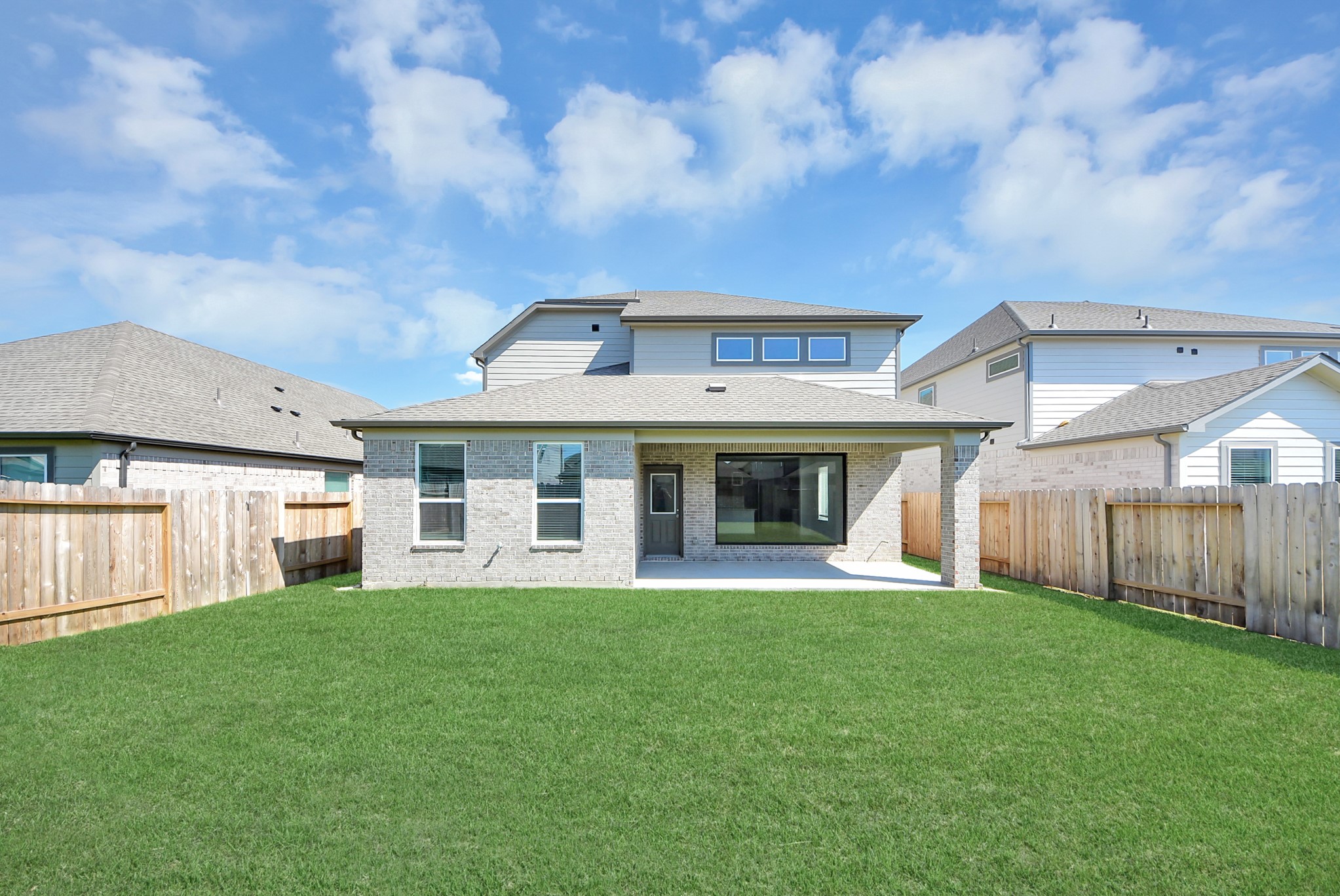 Discover the expansive backyard and its inviting covered patio  a perfect haven for both playtime for the kids and relaxation for adults. This outdoor space is an ideal canvas for your outdoor living dreams, complete with room for patio furniture, a BBQ pit, and endless possibilities for creating your own personalized oasis. Note: sample product photo. Actual exterior and interior selections may vary by homesite.