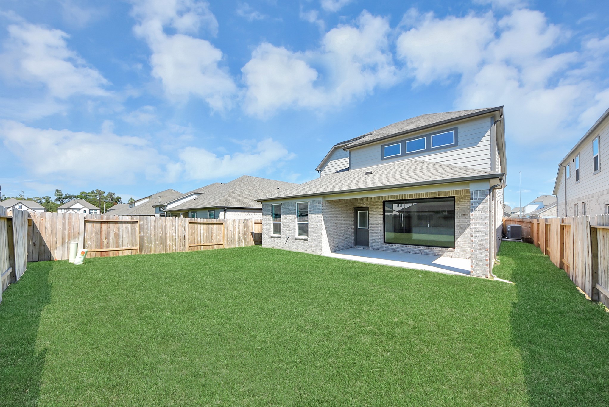 Come and see this spacious backyard with its beautiful covered patio. There is plenty of room for the kids to play and adults to relax. Perfect for your outdoor living space, patio furniture, bbq pit, and so much more. The possibilities are endless!
