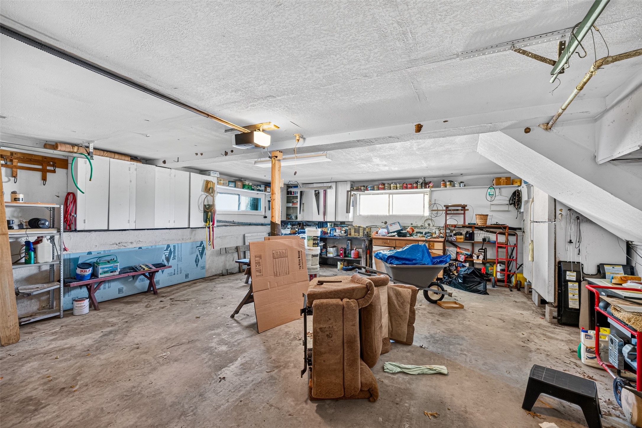Wide and deep two card garage with big workshop space in the back