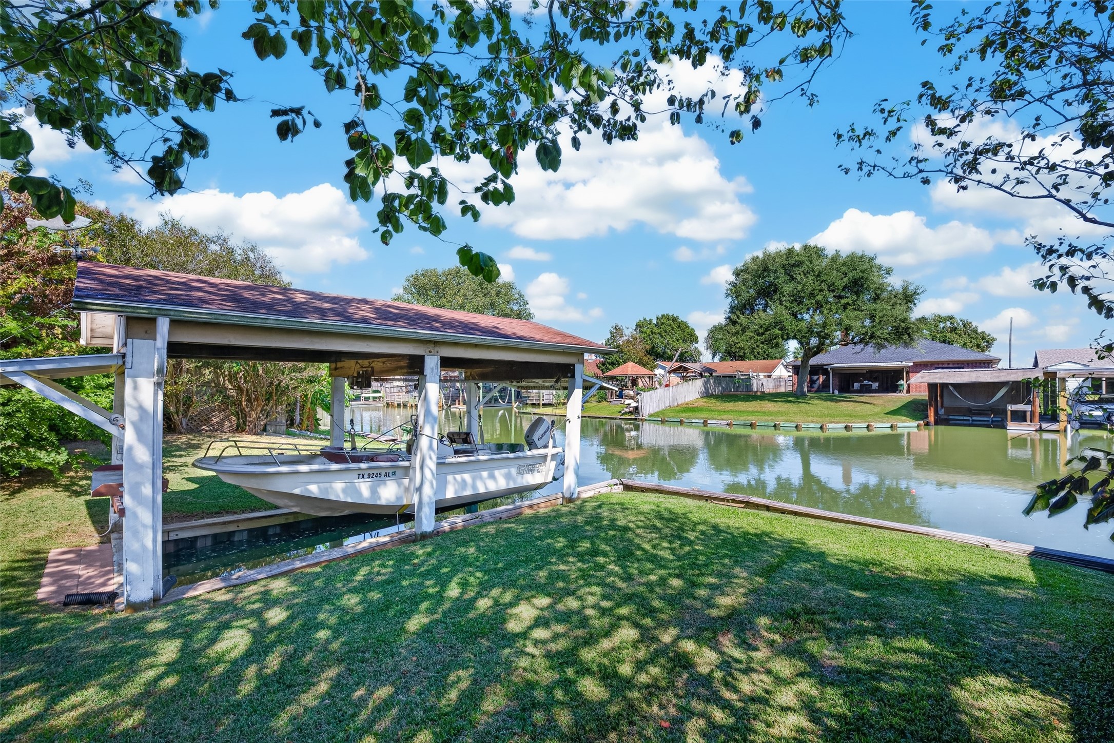 Covered boat slip with Evinrude powered boat included
