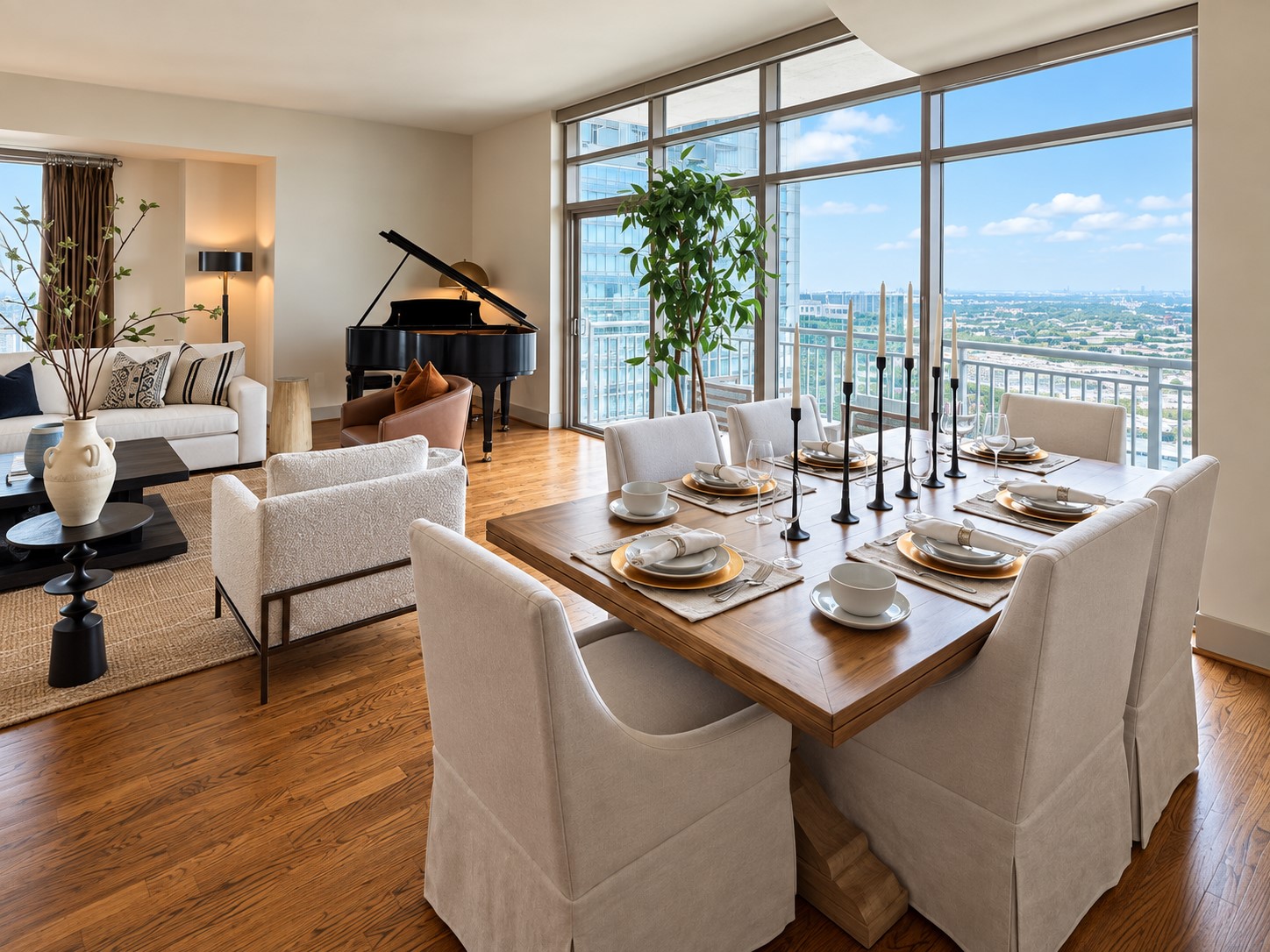 Dinner with a view takes on an entirely different meaning here. The open dining and living spaces flow effortlessly together against a dramatic backdrop of floor-to-ceiling windows, creating a setting that feels sophisticated for entertaining yet intimate enough for everyday life.