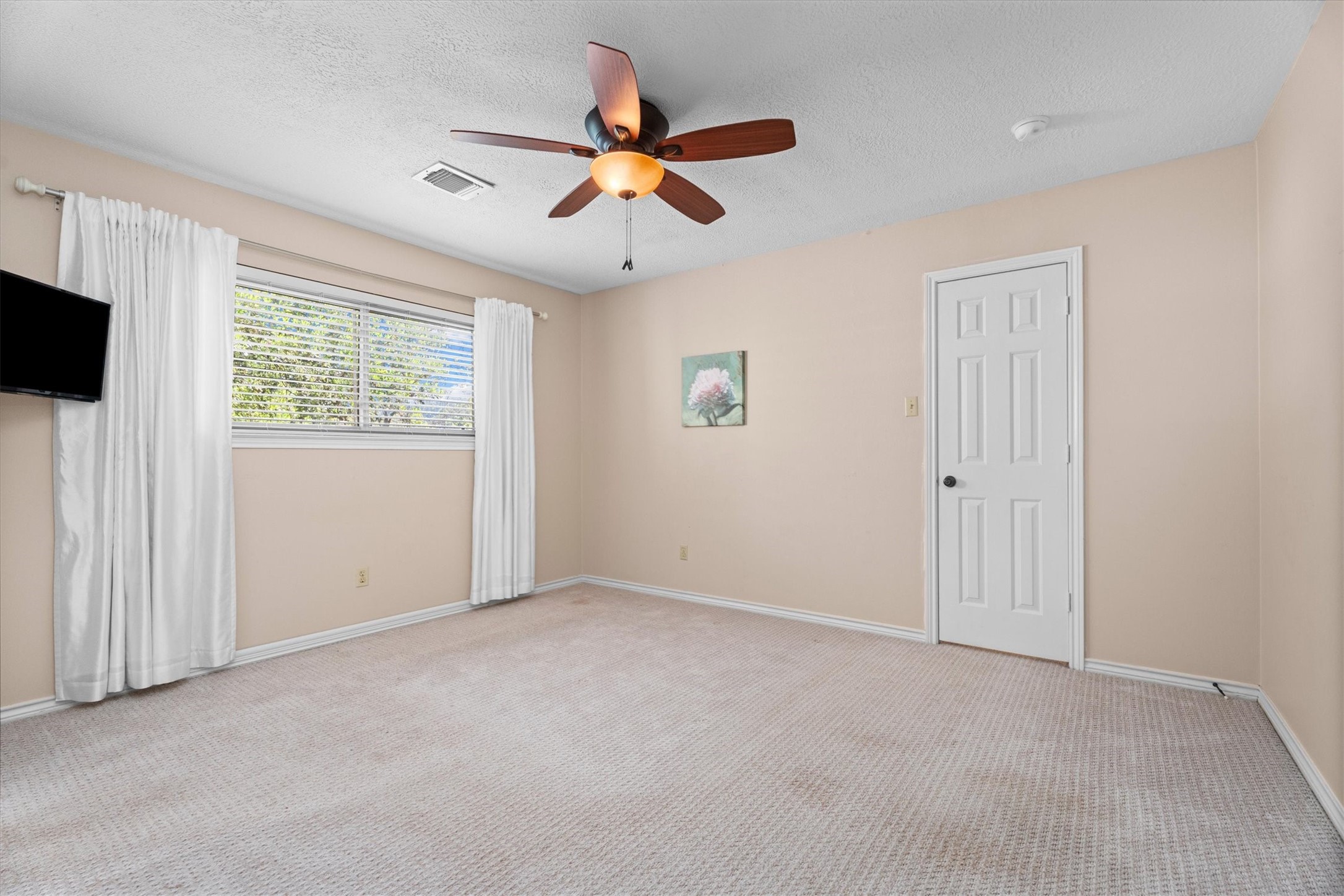The third bedroom upstairs includes a lovely view, large walk-in closet, and a private en-suite bathroom.