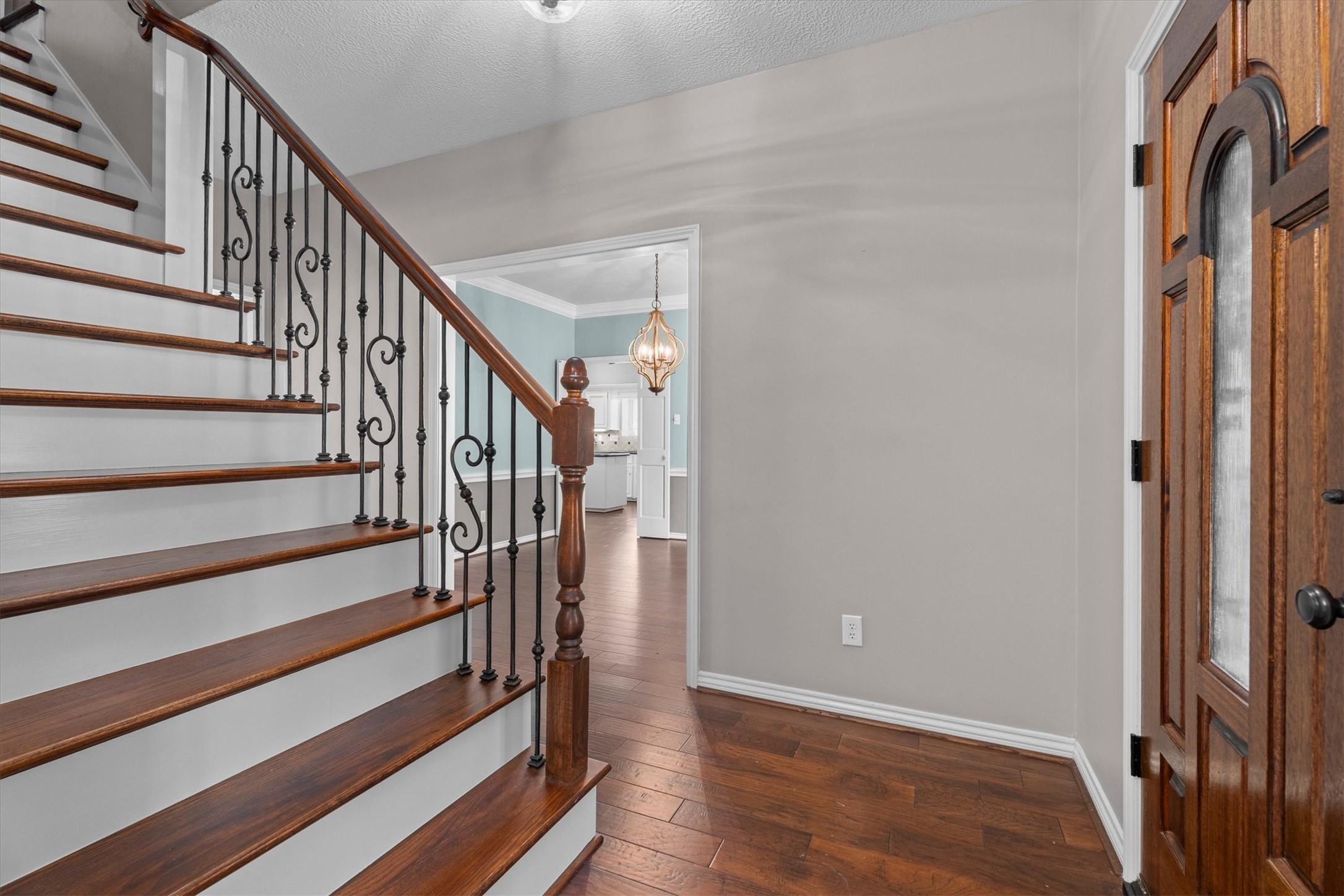 The staircase has also been updated with wood floors and wrought iron balusters.