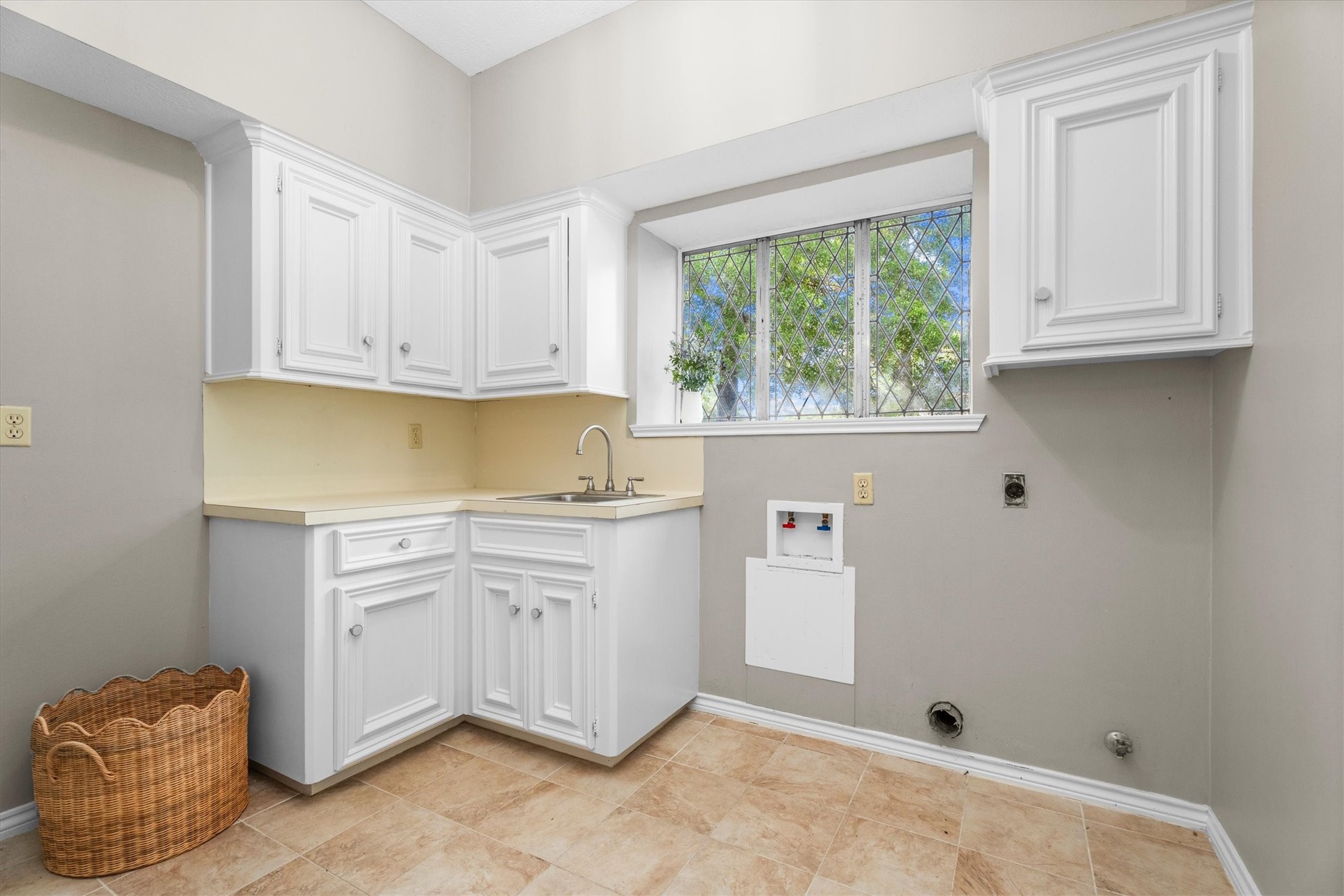 Laundry room attached to the kitchen is a gem! A large walk in pantry, laundry sink, storage, and room for washer and dryer and an extra fridge or freezer provide abundant space for laundry tasks but can easily be closed off from the kitchen.