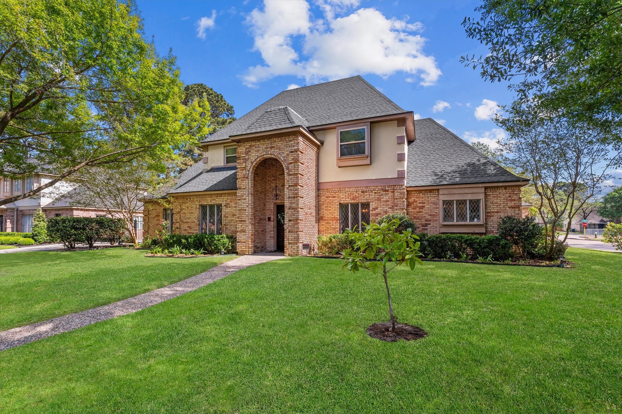 Situated on a large corner lot with lovely oak trees, this home is also a prime neighborhood location at a quiet intersection, across from the neighborhood elementary school and playground.