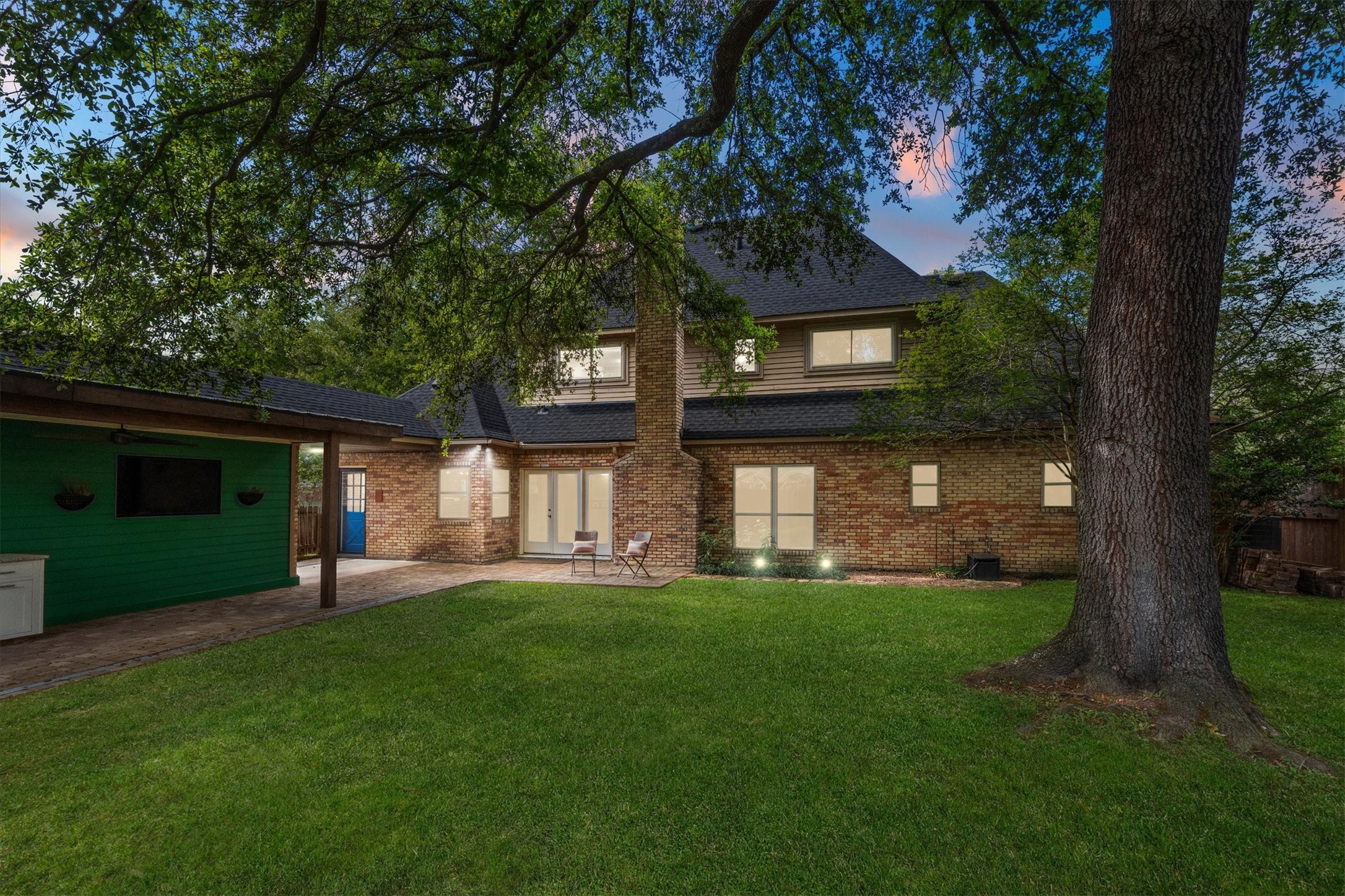 Mature trees offer plenty of backyard shade.