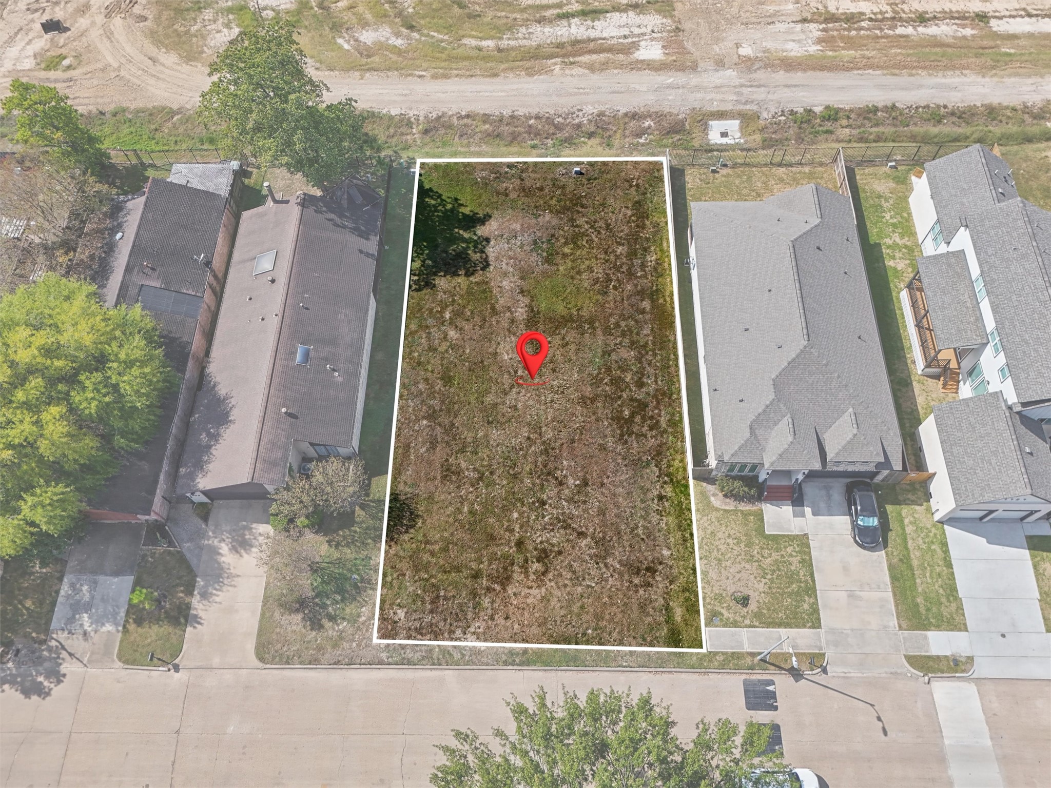 BUILD YOUR DREAM HOME! Imagine the possibilities on this residential lot nestled between established homes! The white outline highlights the property's boundaries, while the red location pin marks the perfect spot to bring your vision to life. Whether you're dreaming of a modern custom home, a spacious family retreat, or your forever home, this vacant lot offers a blank canvas to create something truly special.