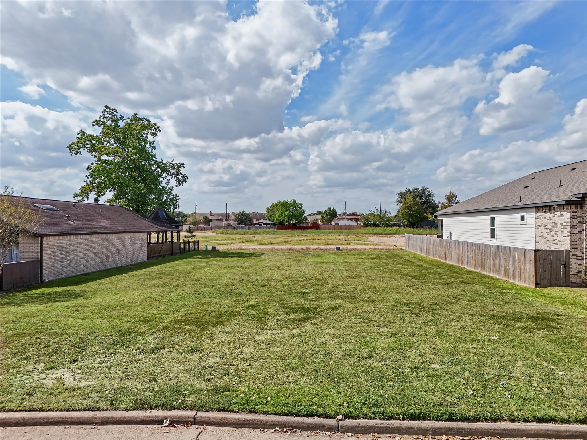 BUILD YOUR DREAM HOME WITH NO BACK NEIGHBORS! Imagine creating your custom dream home on this spacious, cleared residential lot with the added appeal of no immediate rear neighbors! Enjoy an open view behind the property, offering a sense of space and privacy that's hard to find.