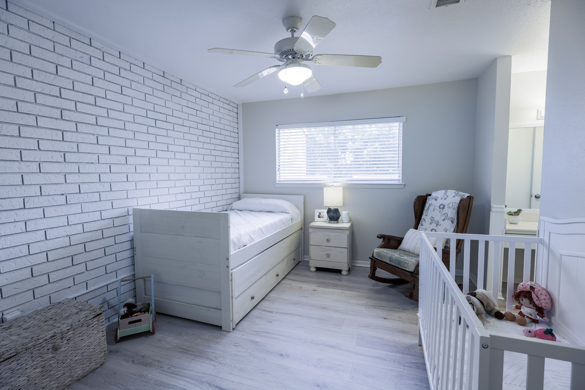 guest bedroom with lovely exposed brick wall