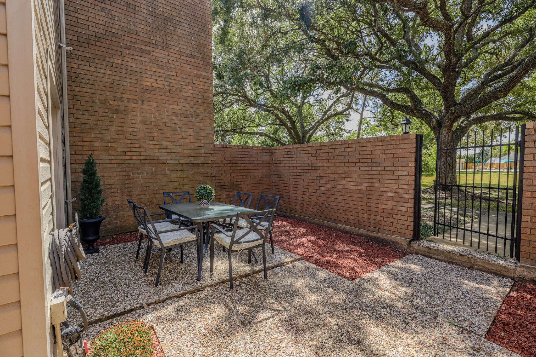 Front courtyard that looks out to the pool area and green space.