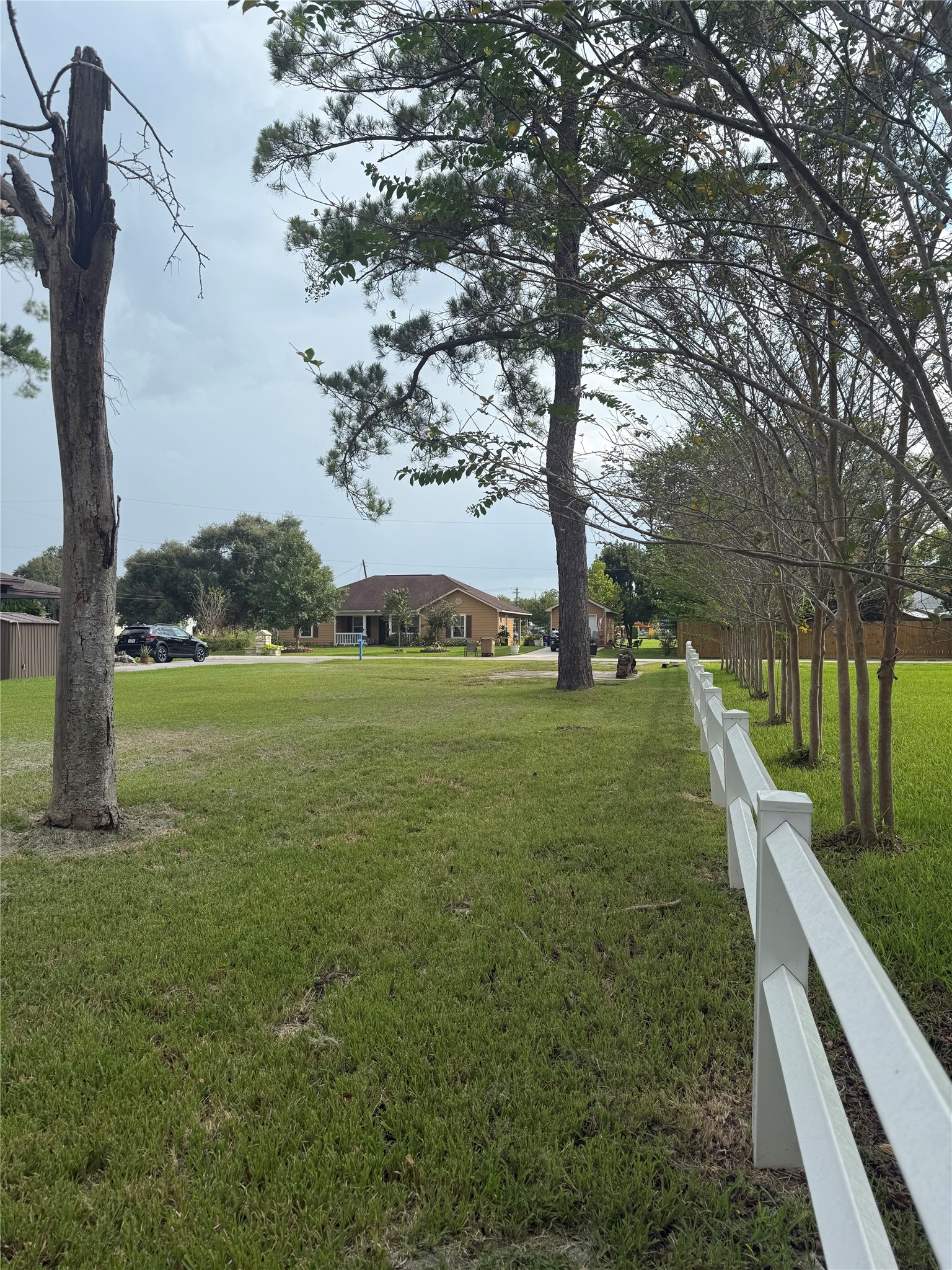 View from back of land that is partially fenced.