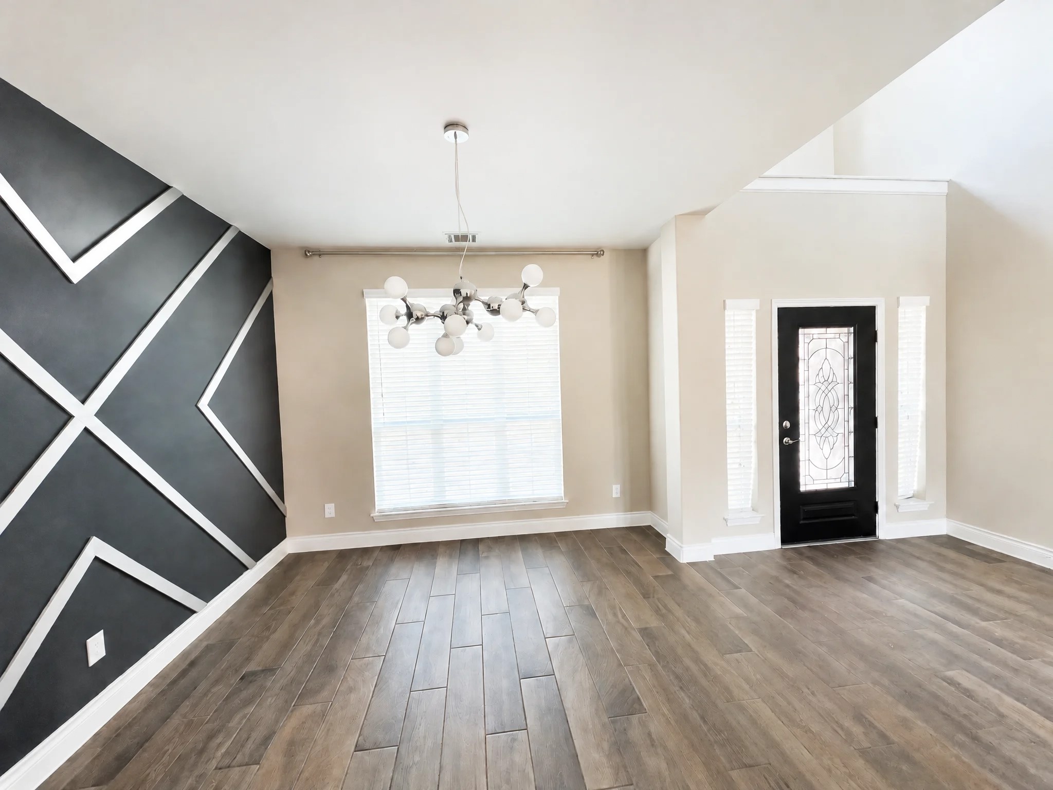 Enjoy a beautiful formal dining room with a grand foyer. Enjoy a beautiful formal dining room with a grand foyer.