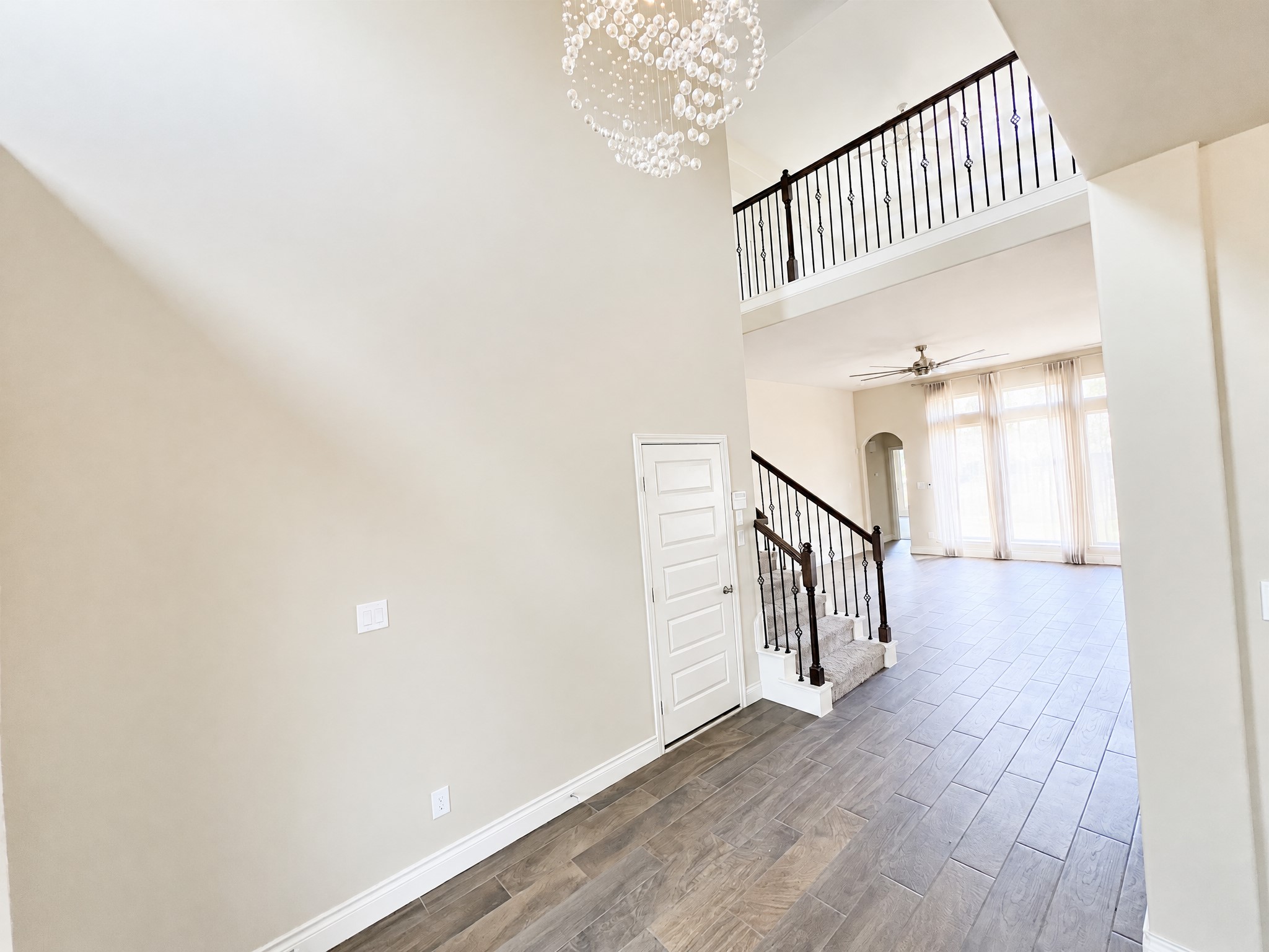 Gorgeous foyer that flows to a enormous living area with large floor to ceiling windows. Gorgeous foyer that flows to a enormous living area with large floor to ceiling windows.