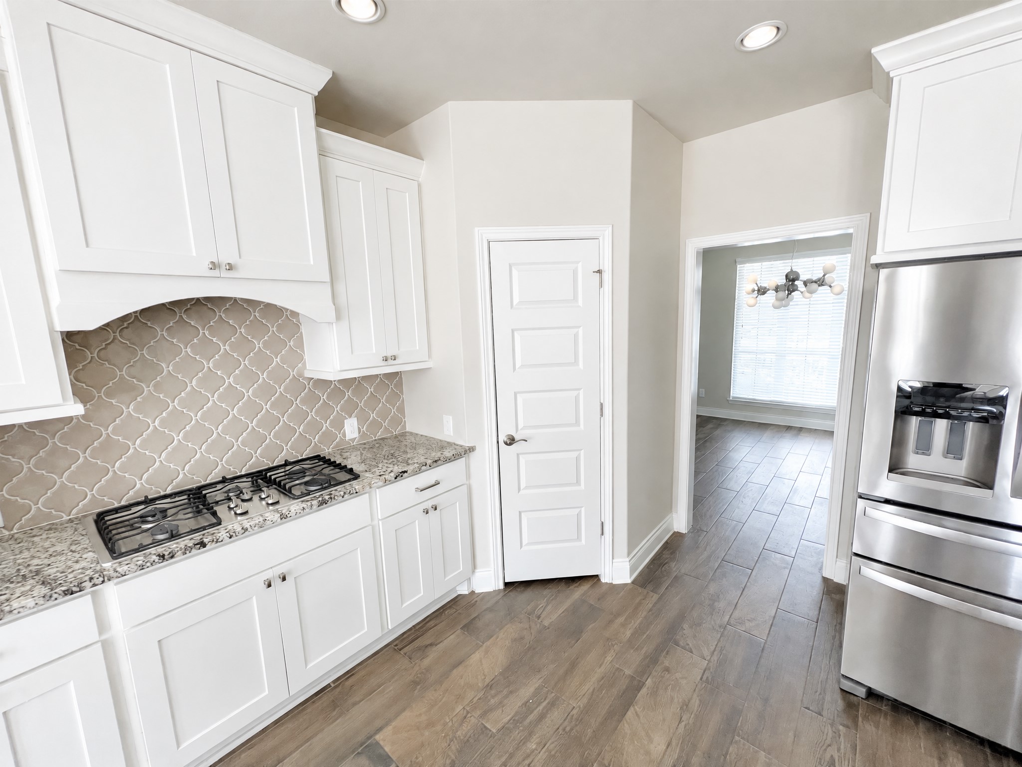 Kitchen contains large gas range with appliances. Kitchen contains large gas range with appliances.