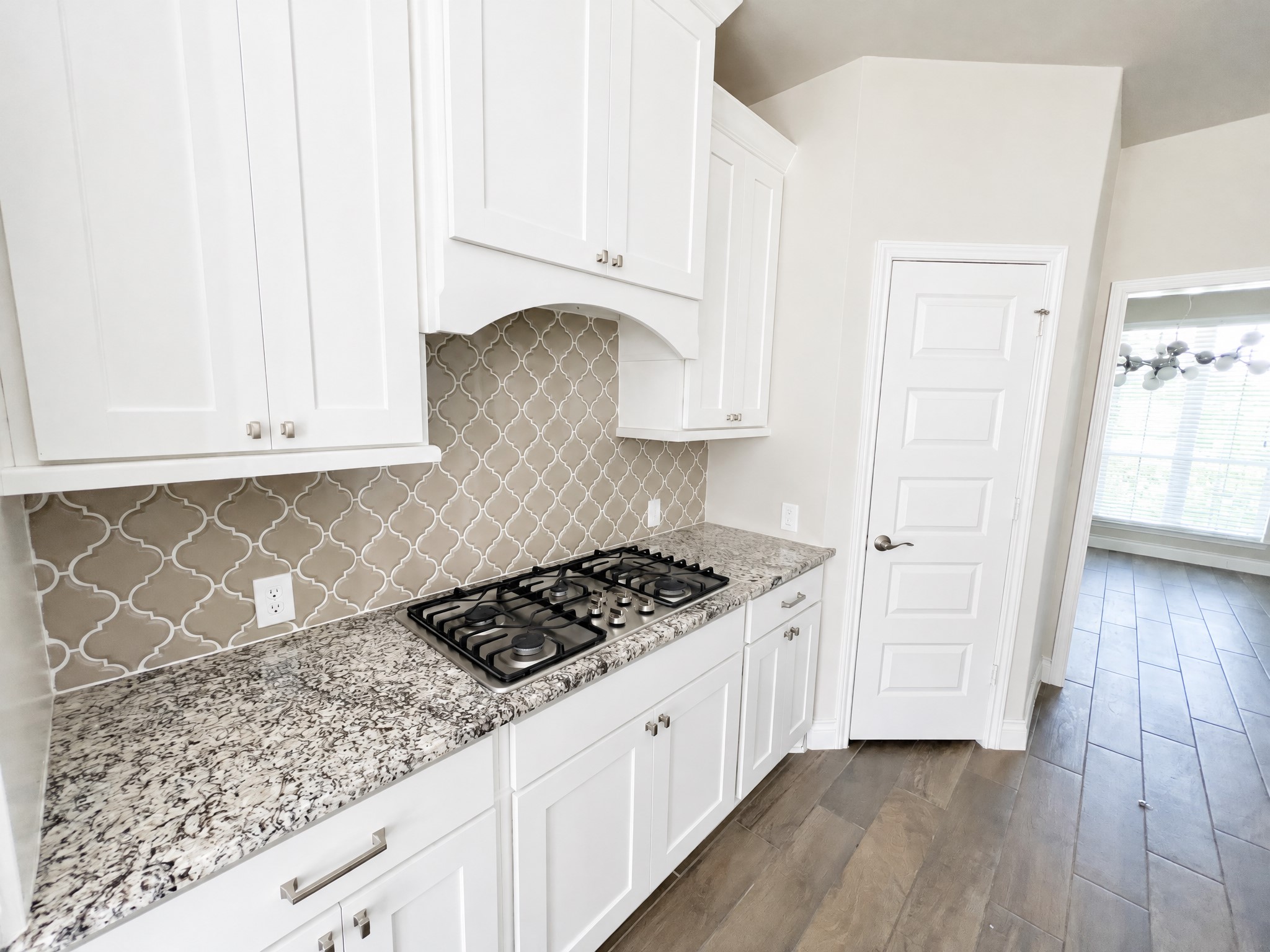 Kitchen contains large gas range with appliances. Kitchen contains large gas range with appliances.