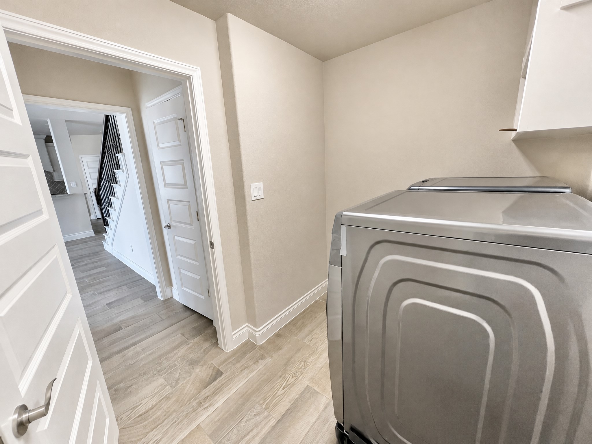 Utility room complete with washer and dryer. Utility room complete with washer and dryer.