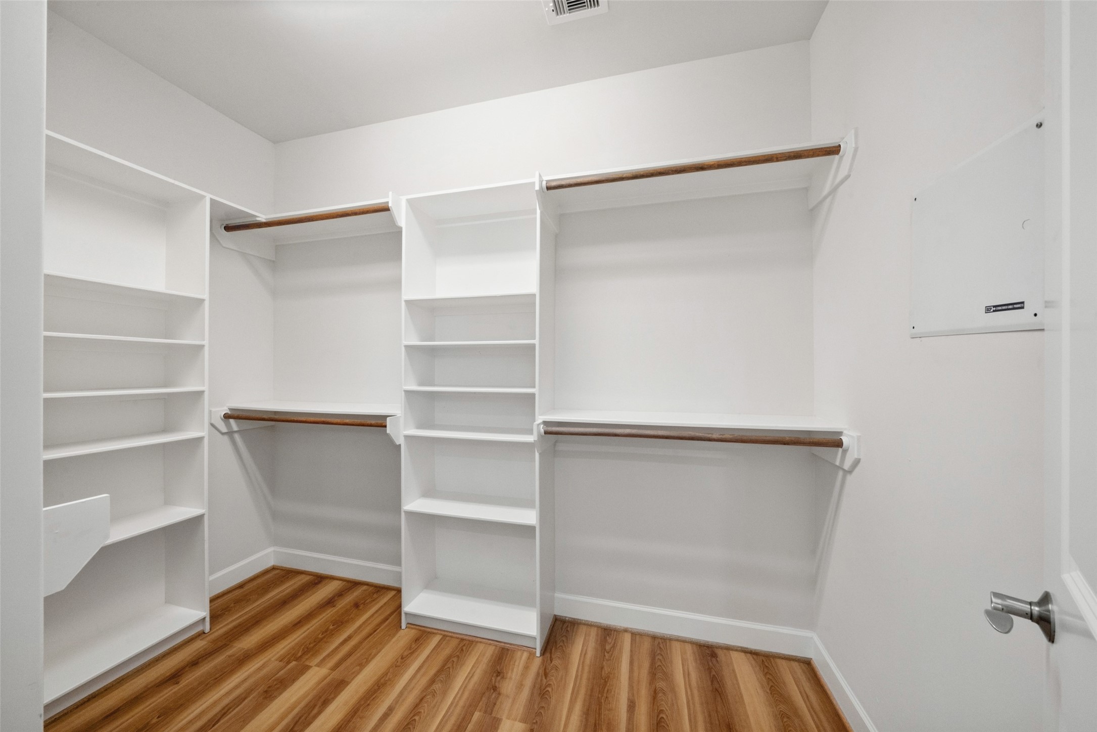 Here is your large walk-in closet with custom shelving!