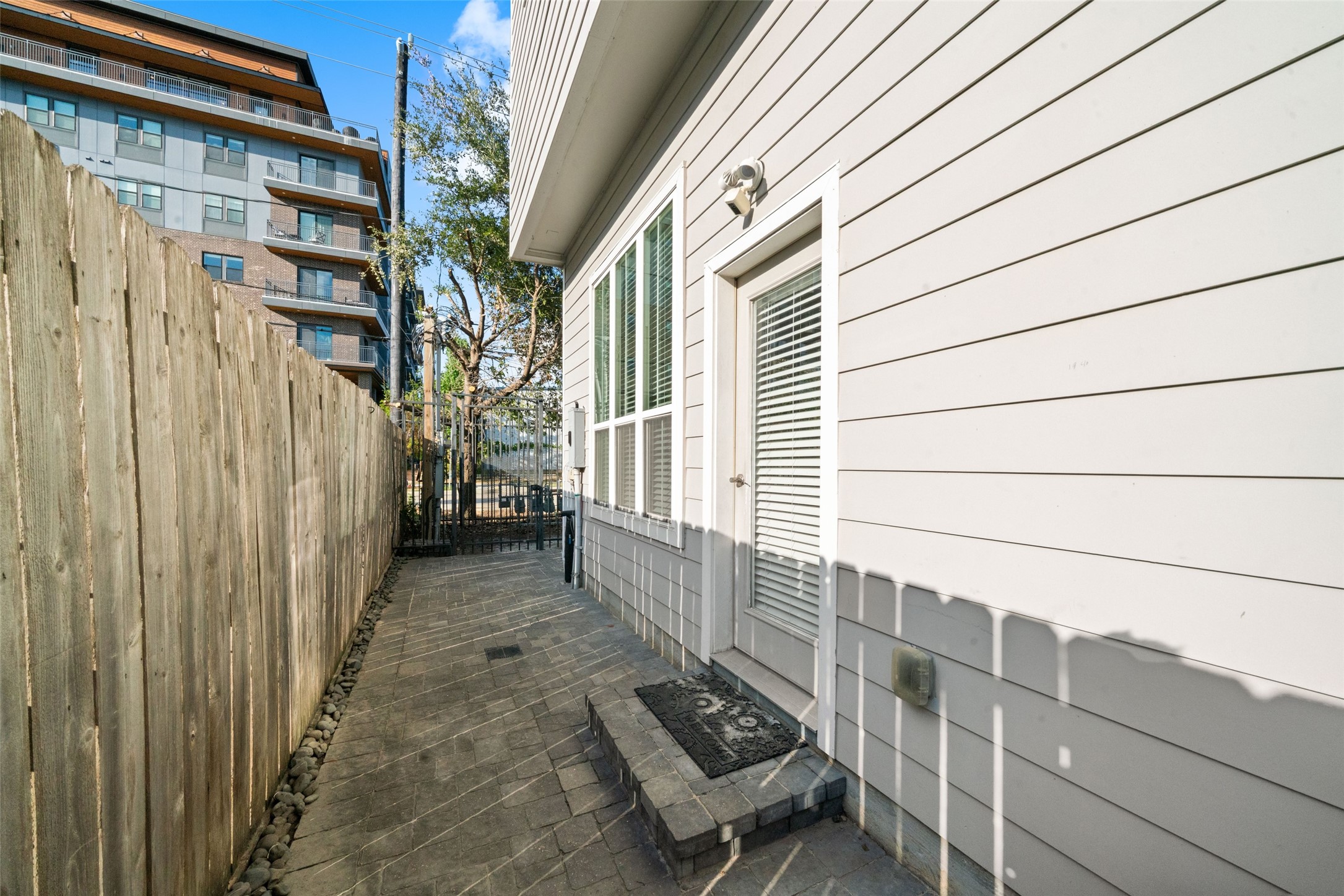 Here is your fenced in back patio, the perfect size for a table and chairs for an evening wind-down or morning coffee.