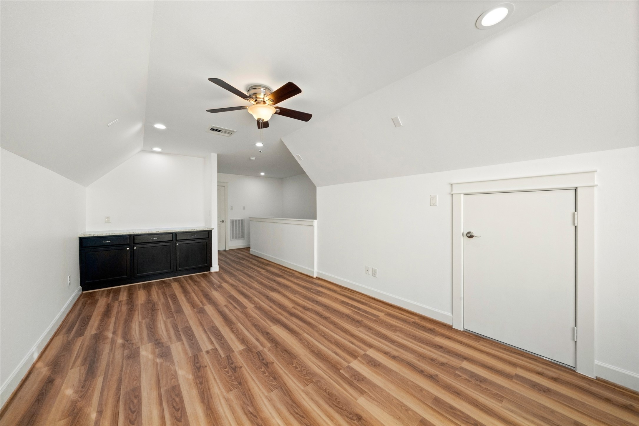 Your HUGE game room!! Also with new luxury vinyl plank flooring, updated recessed lights and large windows for loads of natural light. This space would be perfect for a private study/office also!