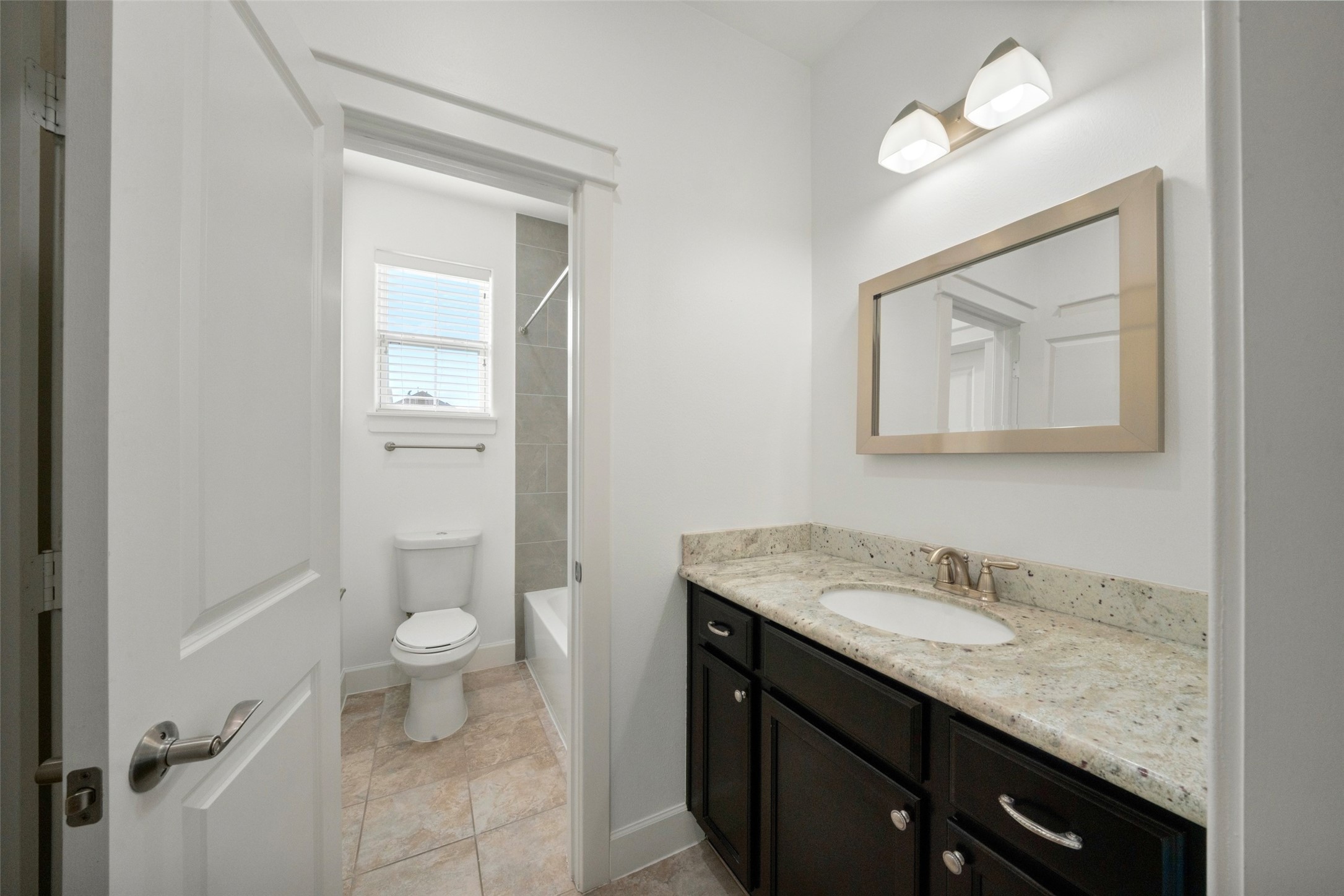 Both secondary bedrooms share this Jack and Jill bathroom! This sink vanity area and closet belong to bedroom 2.