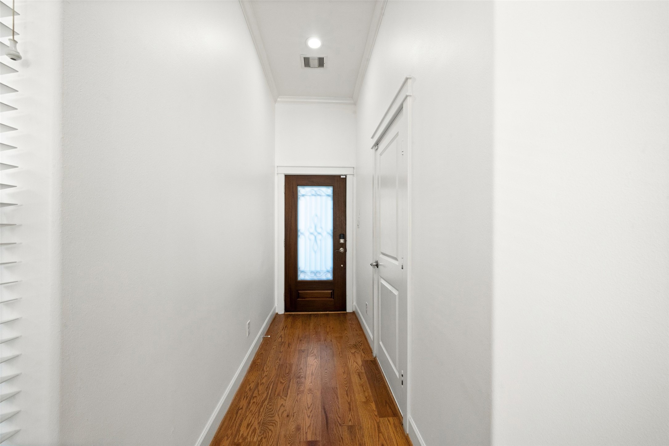 Upon entry, the door pictured to the right is your large 2-car garage equipped with overhead storage shelves. Upon entry, the door pictured to the right is your large 2-car garage equipped with overhead storage shelves.