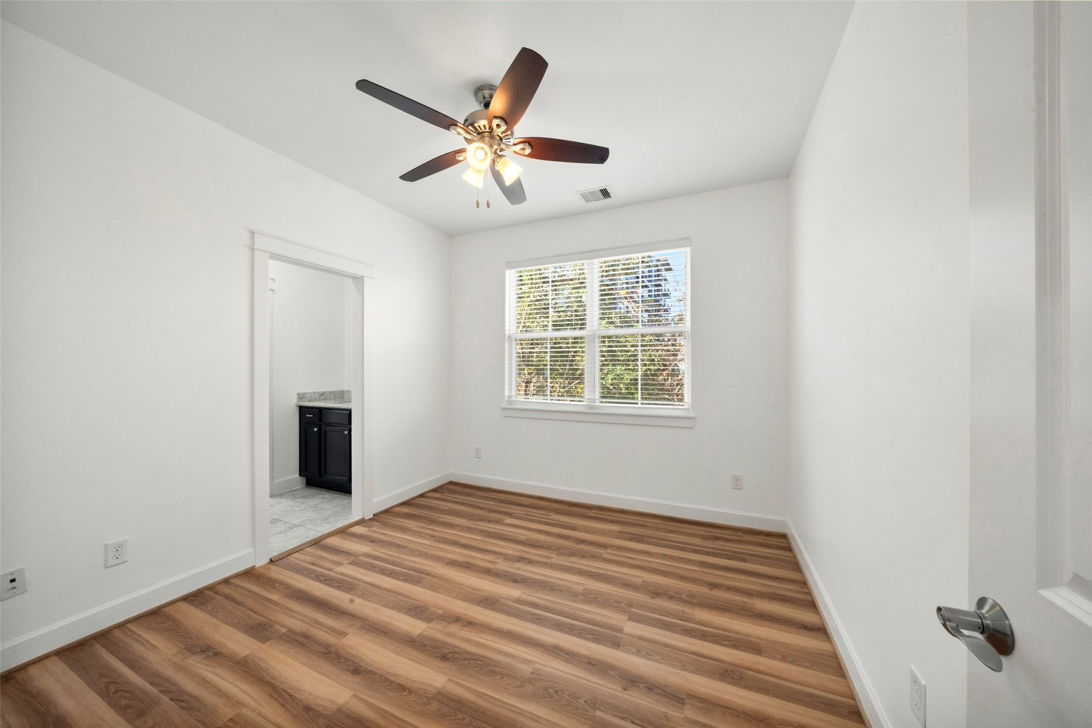 Here is the 2nd of your 3 bedrooms also located on the second floor with access to a Jack and Jill bath, and equipped with new luxury vinyl plank flooring.