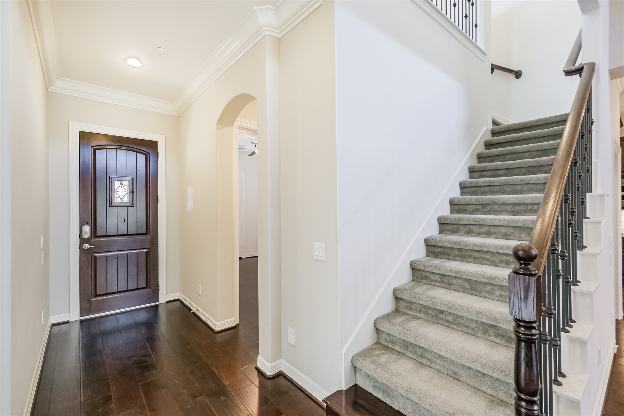 Stairs to second-floor game room with half bath.