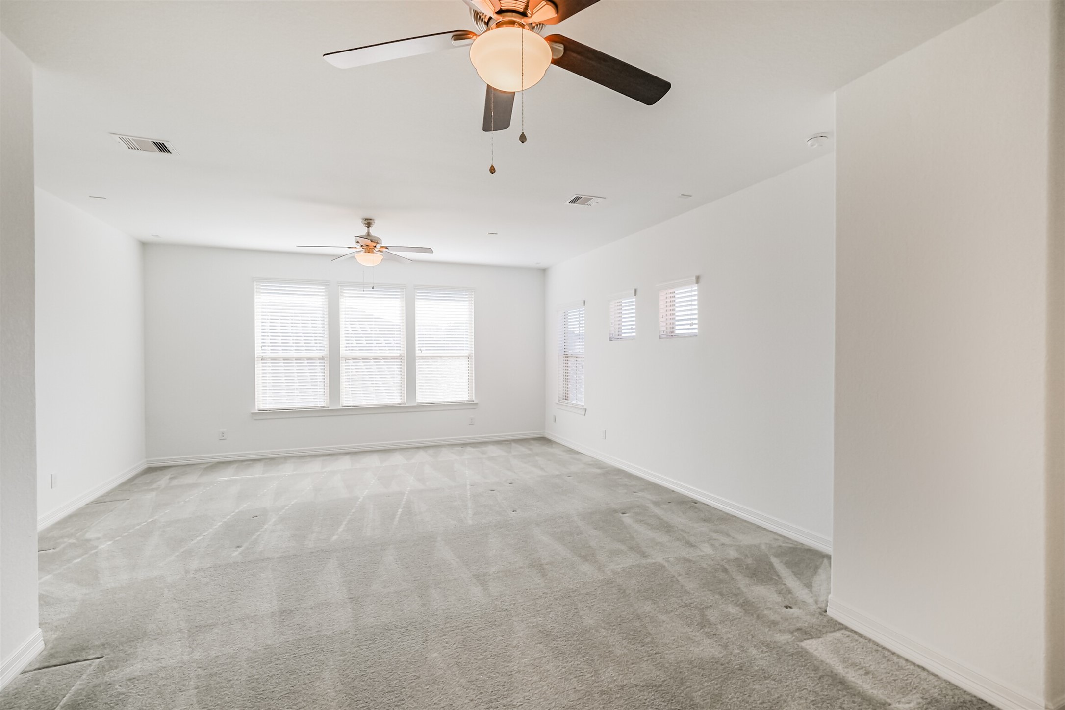 A blank canvas for pool table, media room or crafting.