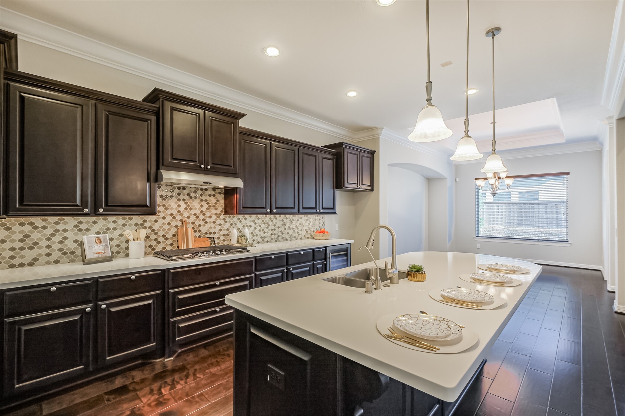 Abundant countertop space for food prep and extensive cabinetry for storage.