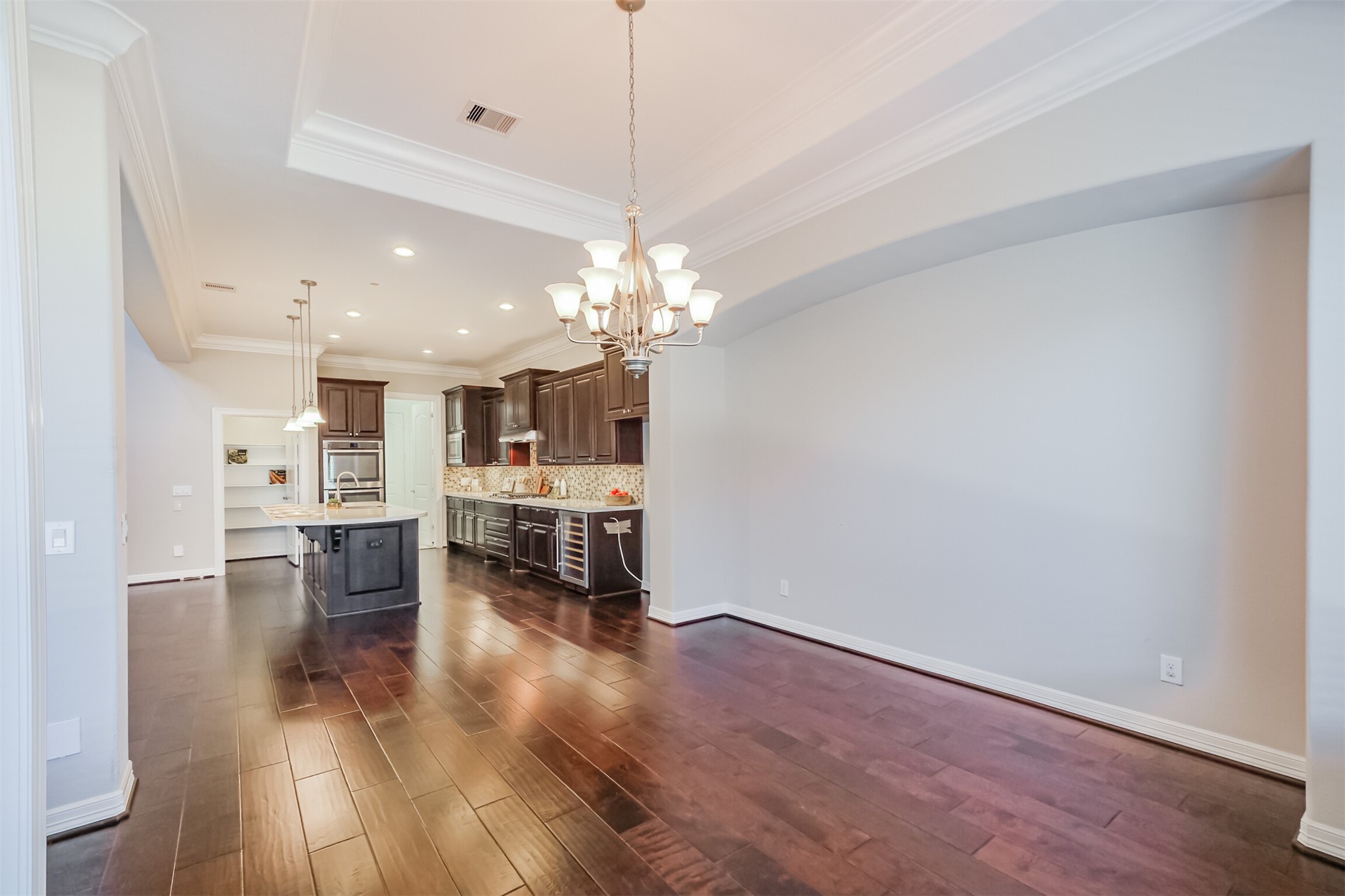 Expansive wall space perfect for adding a buffet or glass display cabinet.