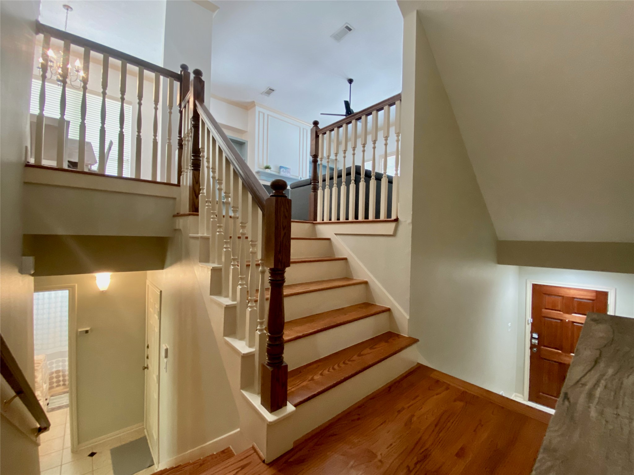 Split staircase leads to front door and to secondary bedrooms