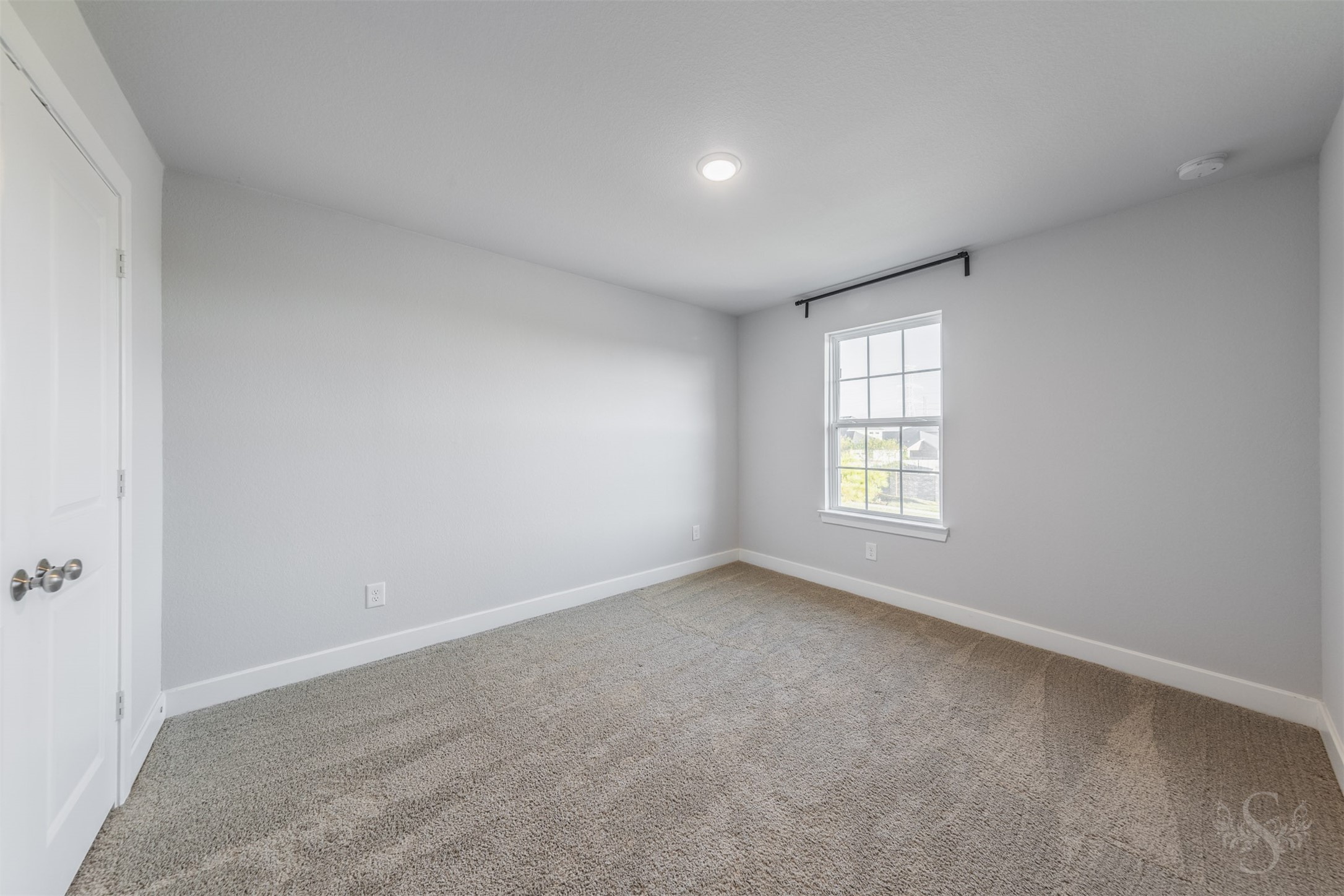 Secondary bedroom upstairs features soft carpeting and neutral walls, ready to complement your favorite dcor. Theres plenty of space for a comfortable bed and a desk for homework or creative projects.