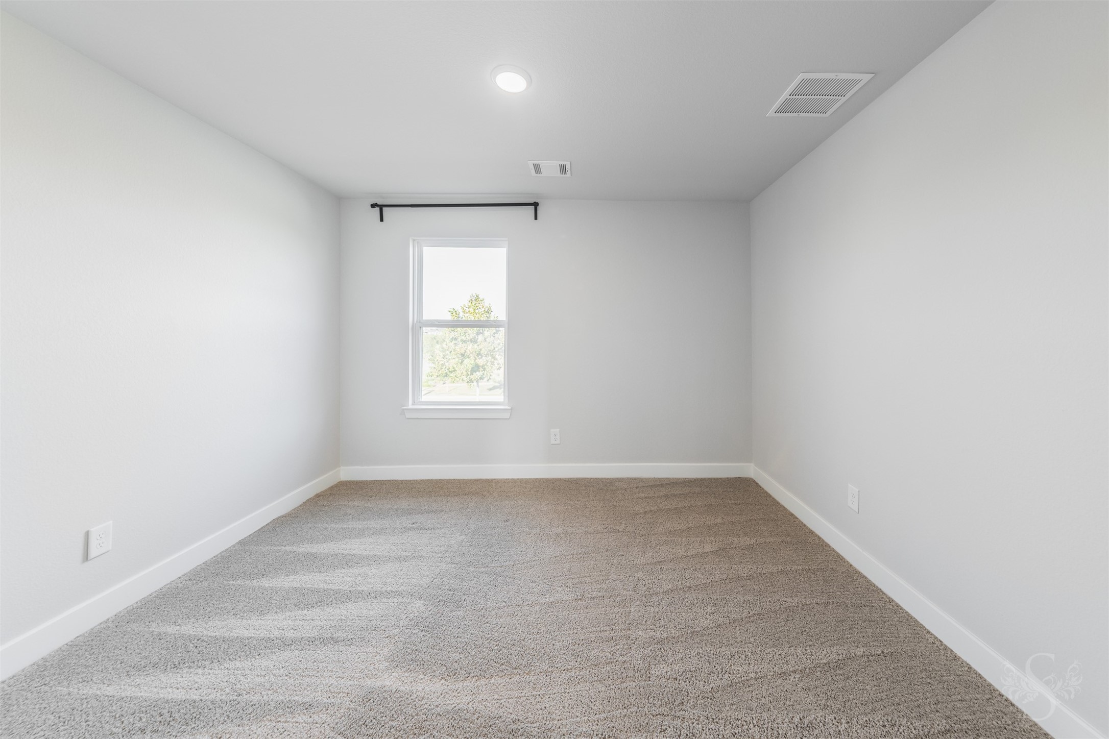 Secondary bedroom upstairs features soft carpeting and neutral walls, ready to complement your favorite dcor. Theres plenty of space for a comfortable bed and a desk for homework or creative projects.