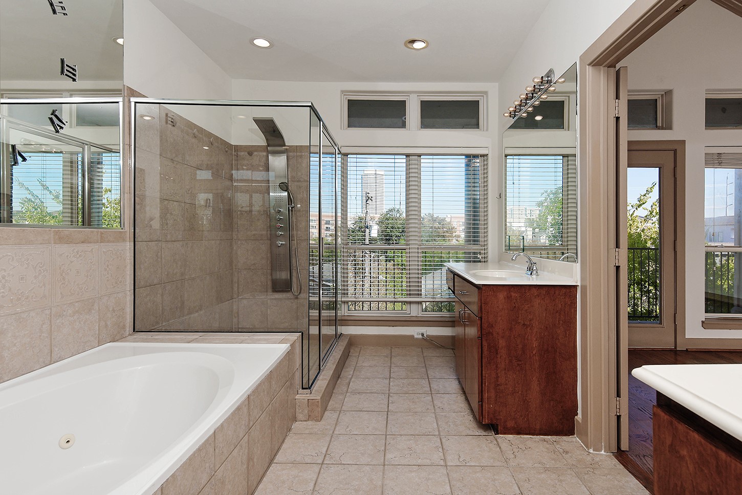 Primary Bathroom with dual sinks, standing shower and soaking tub
