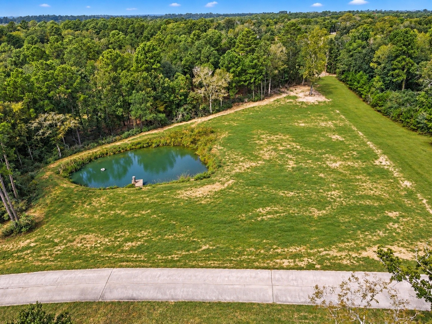 Edited photo to show pond at it's fullest and additional grass grown.