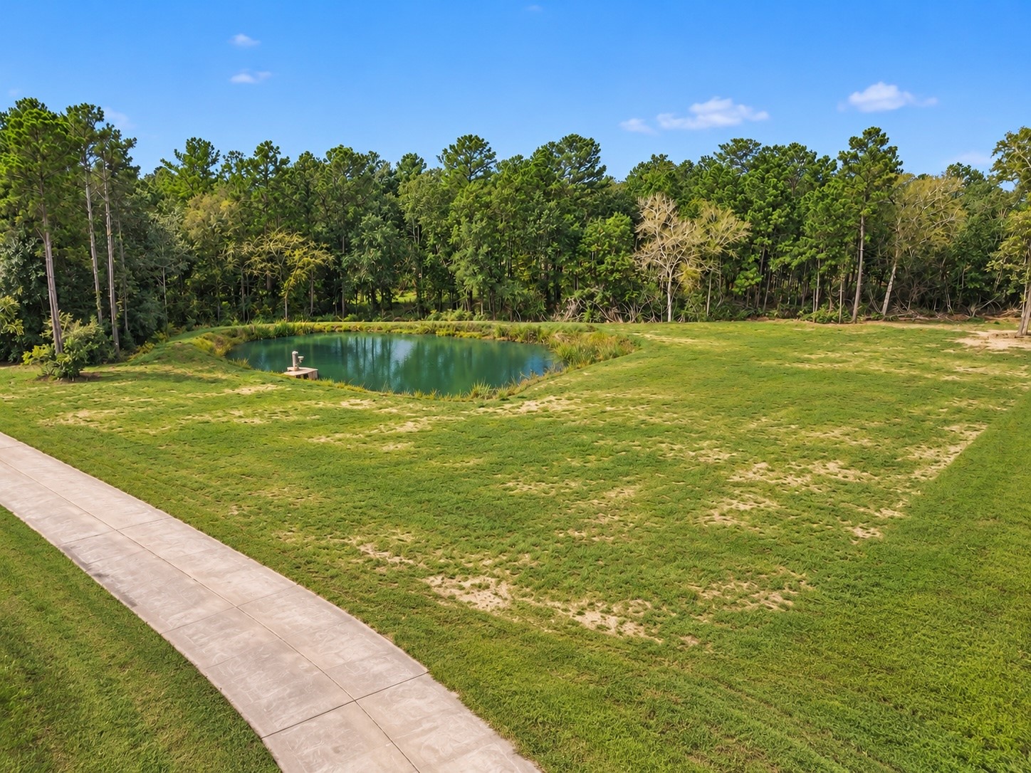 Edited photo to show pond at it's fullest and additional grass grown. Edited photo to show pond at it's fullest and additional grass grown.
