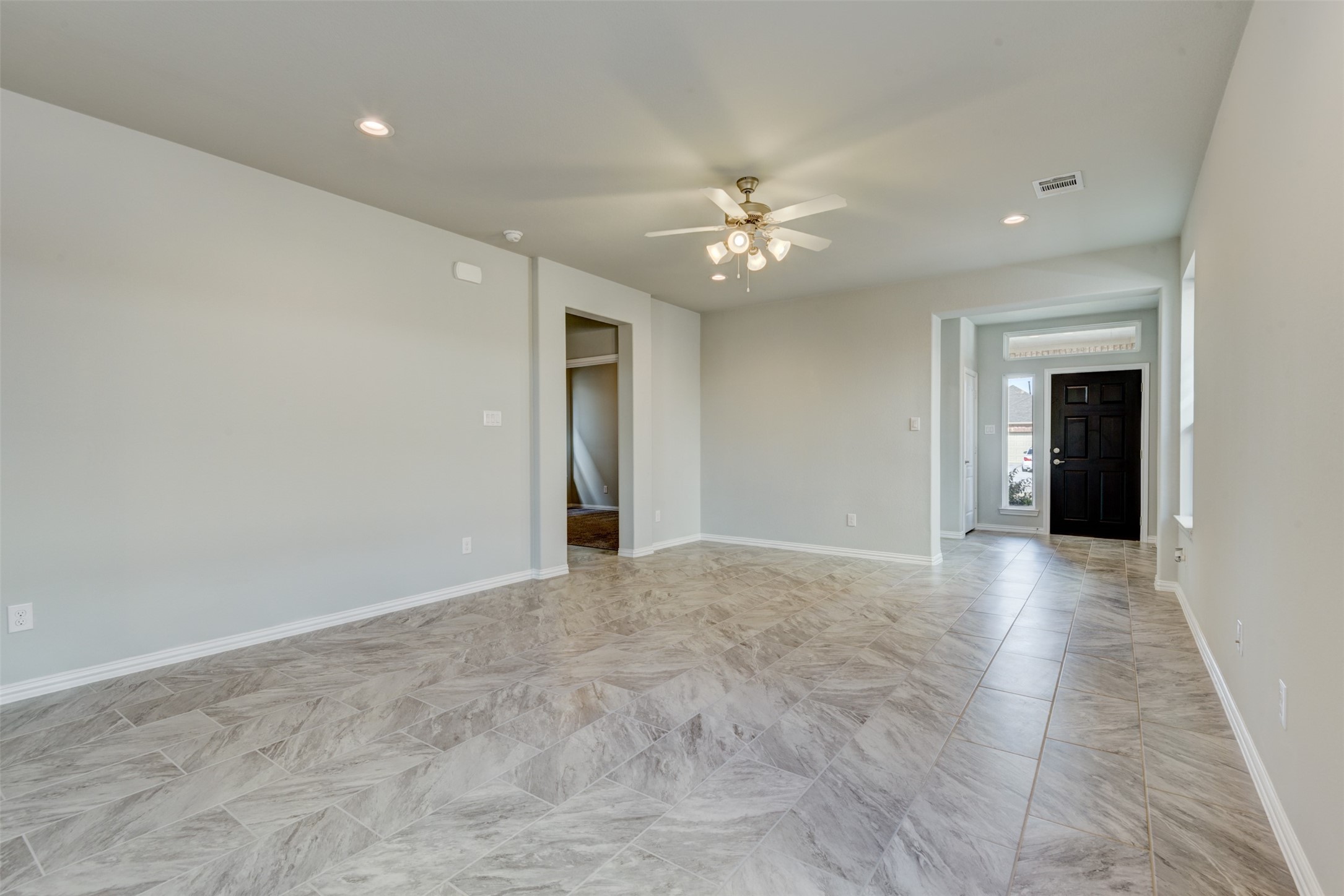 Noticing the tile floors and the high ceilings